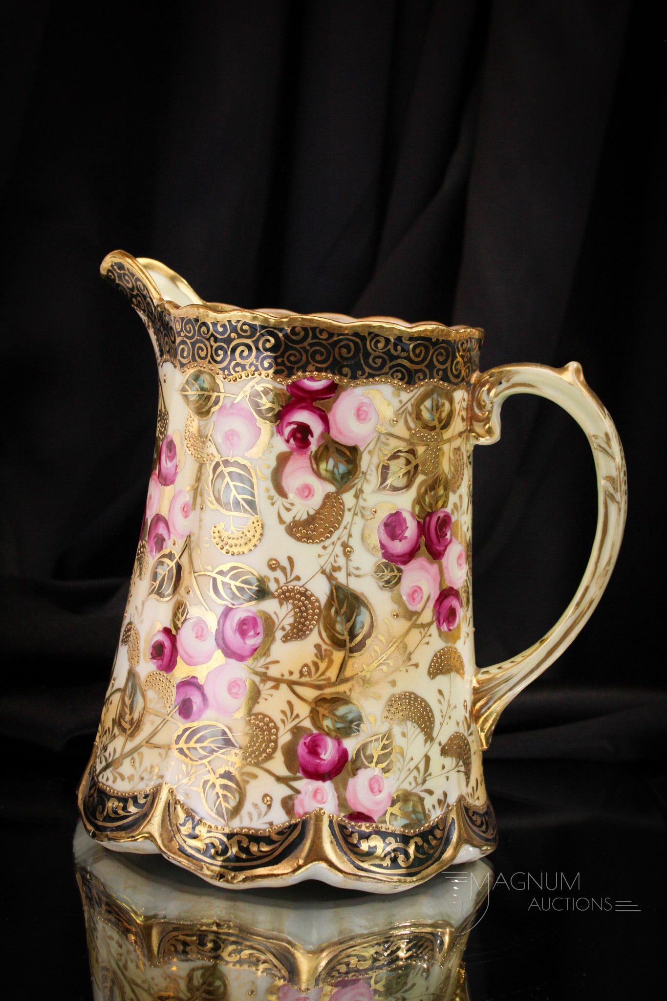 Marked Nippon Roses & Gold Water Pitcher: Select offering of marked Nippon porcelain water pitcher decorated with a bounty of roses and gold work. Pitcher measures 8 1/2" tall.