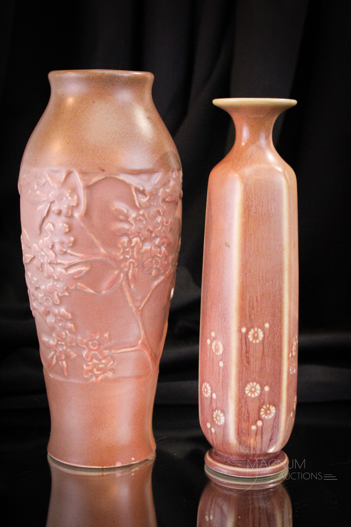 2 pc Lot Rookwood Pottery Vases: Two hand-picked exmaples of Rookwood pottery vases in Mauve matte. Example 1. marked "XXII", "2584" with embossed wild daisies. Example 2. with flowers embossed marked "XXII', ""2607". The latter with