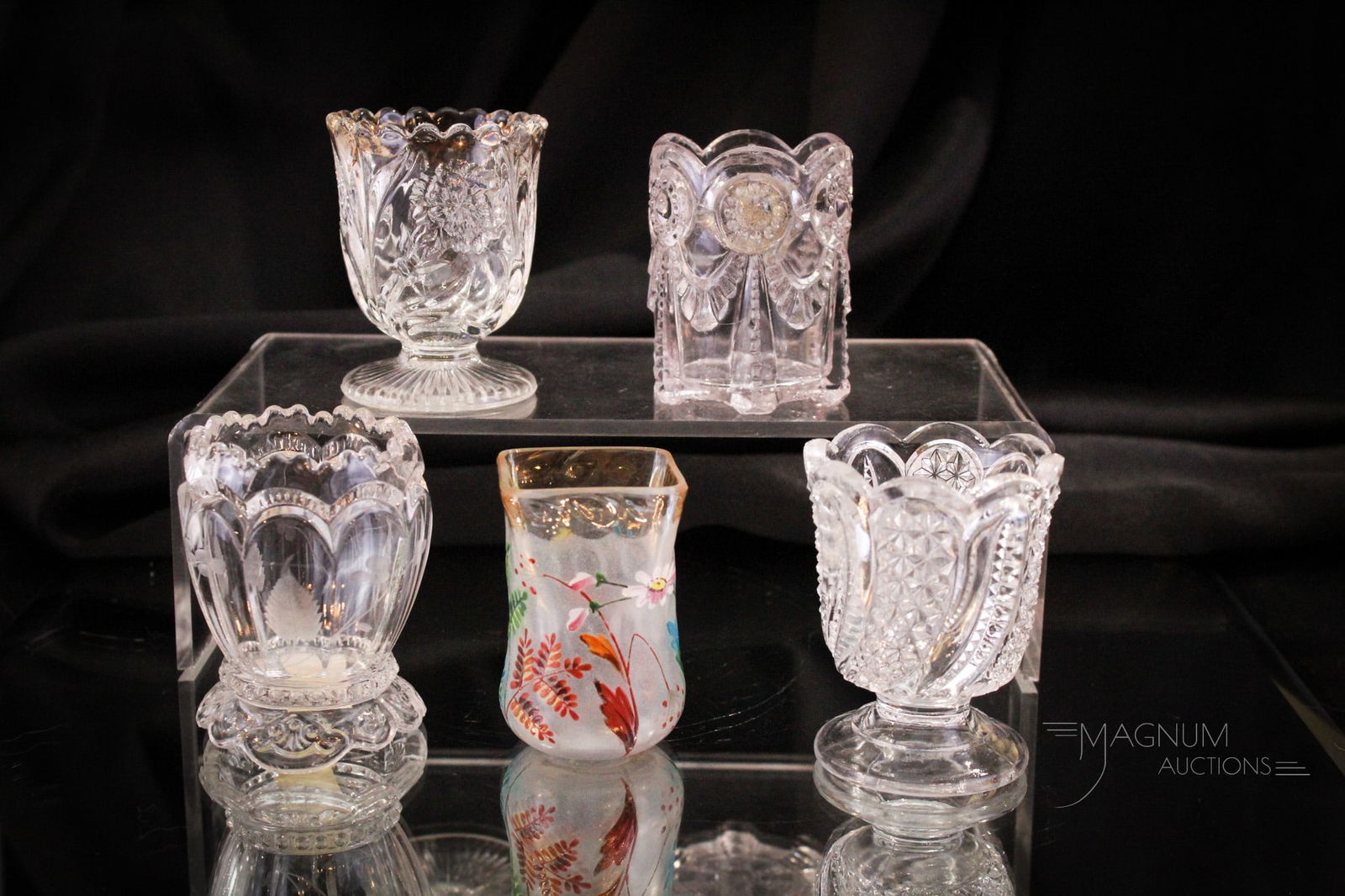 5 pc Lot Victorian Glass Toothpick Holders McKee Riverside & More: Fine selections abound in this lot of clear Victorian toothpick holders. One is as nice as the next. Represented by a Feather, an Alabama, an engraved Riverside and so much more! Tallest measures 2 3/
