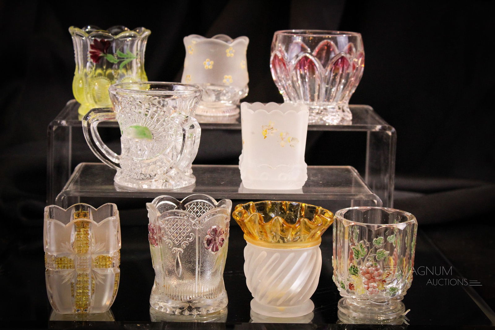 9 pc Lot Victorian Glass Toothpick Holders: Nine select examples of Victorian pattern glass toothpick holders. Examples include an amber stained Gonterman Swirl, a Findlay Klondyke, an Atlanta (Frosted Lion)and more. Tallest measures 2 1/2". Fr