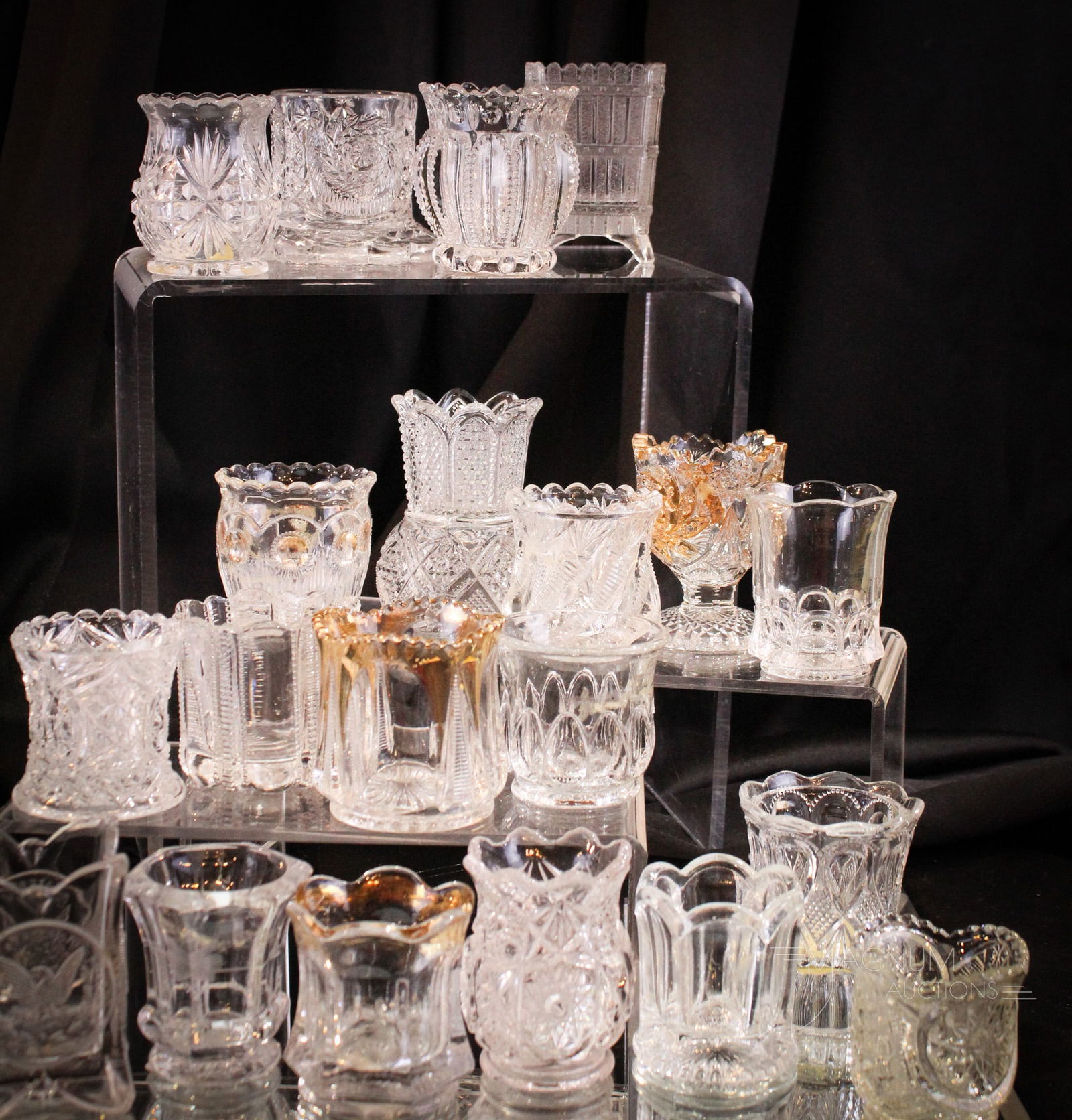 20 pc Lot Victorian Pattern Glass Toothpick Holders: Twenty fine and highly prized Victorian toothpick holders in this lot. Each a fine example. Some gilt decorated. Tallest measures 3 1/2".