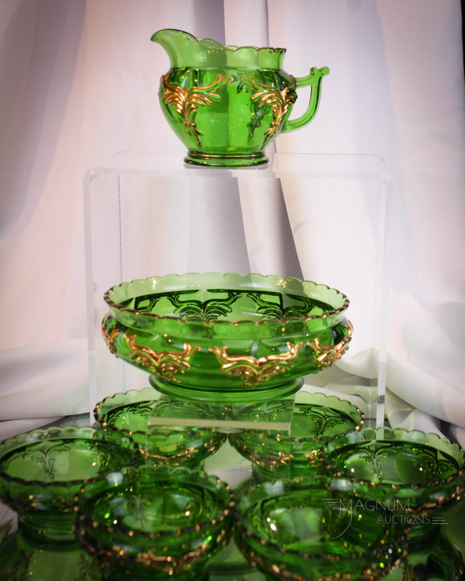 8 pc Lot Heisey Winged Scroll Victorian Glass Berry Set & More: Fine eight piece ensemble of green with gold decoration Winged Scroll pattern Heisey glass. This lot is made up of a seven piece berry set along with a creamer. Tallest measures 4". One individual ber