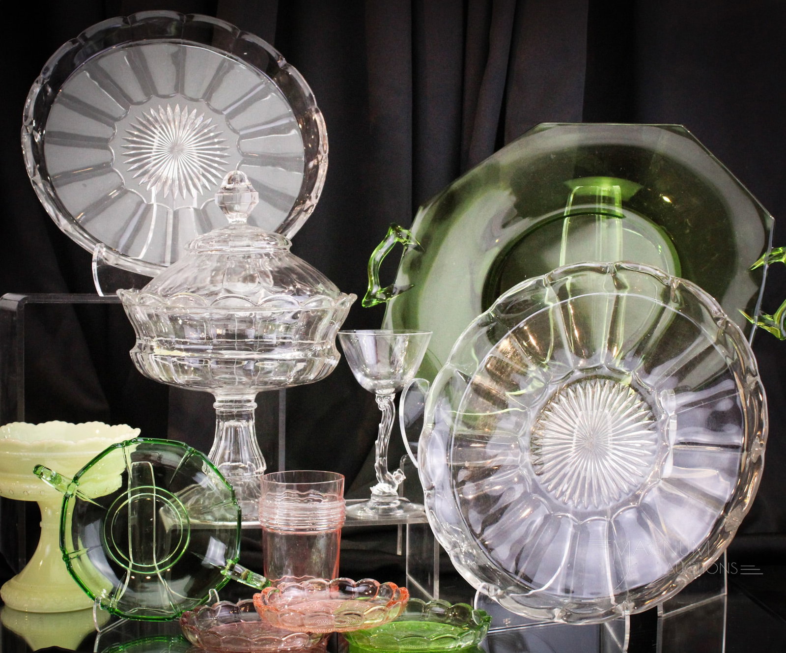 11 pc Lot Heisey Glass: Eleven finer than fine examples of Heisey glass. Colors represented are Flamingo, Moongleam and Custard. Forms include a Chanticlear stem and more. Tallest measures 10 1/4".