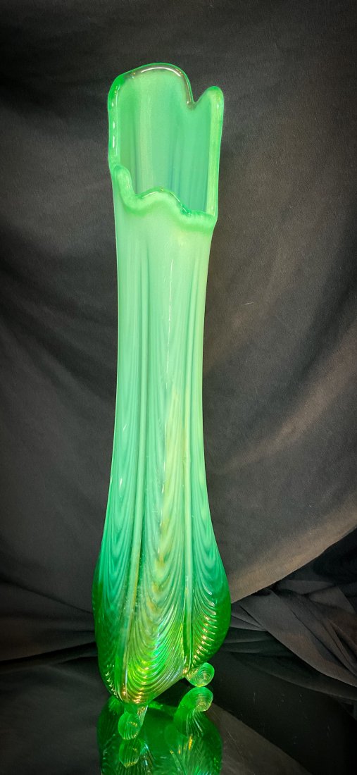 Rare Fenton Levay Uranium Green Opalescent Glass Drape Swung Vase: A rare find and possibly an anomaly. Fenton for Levay, uranium green opalescent drape pattern 15” swung vase with 3 curled feet. Glows under black light. Possible anomaly since usually has irrid