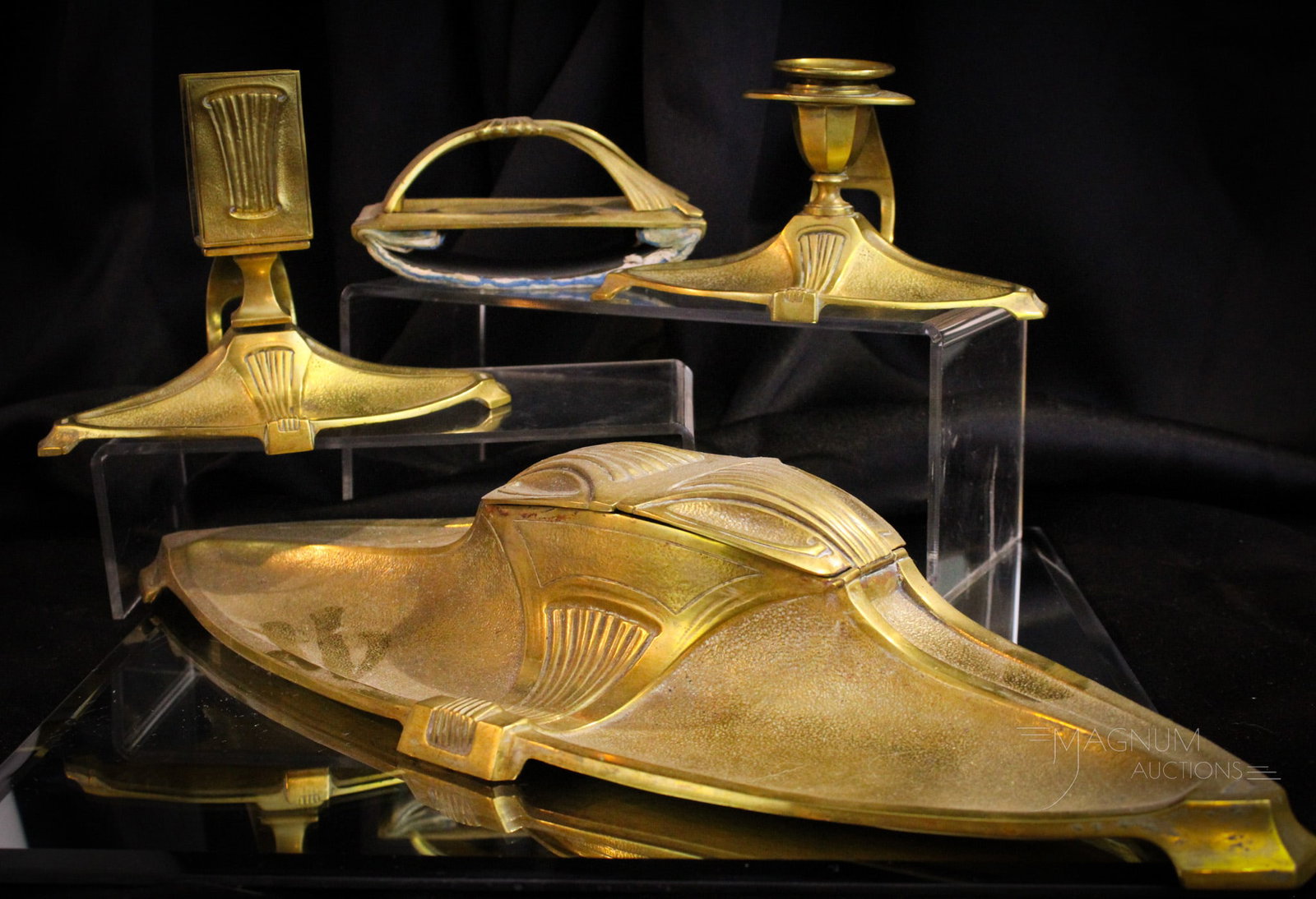 4 pc Antique Art Nouveau Desk Set: Fine offering of an Art Nouveau desk ensemble. Set features an inkwell, chamberstick, ink blotter, and match holder. Largest pieces measures 4 3/4" tall, 17" long