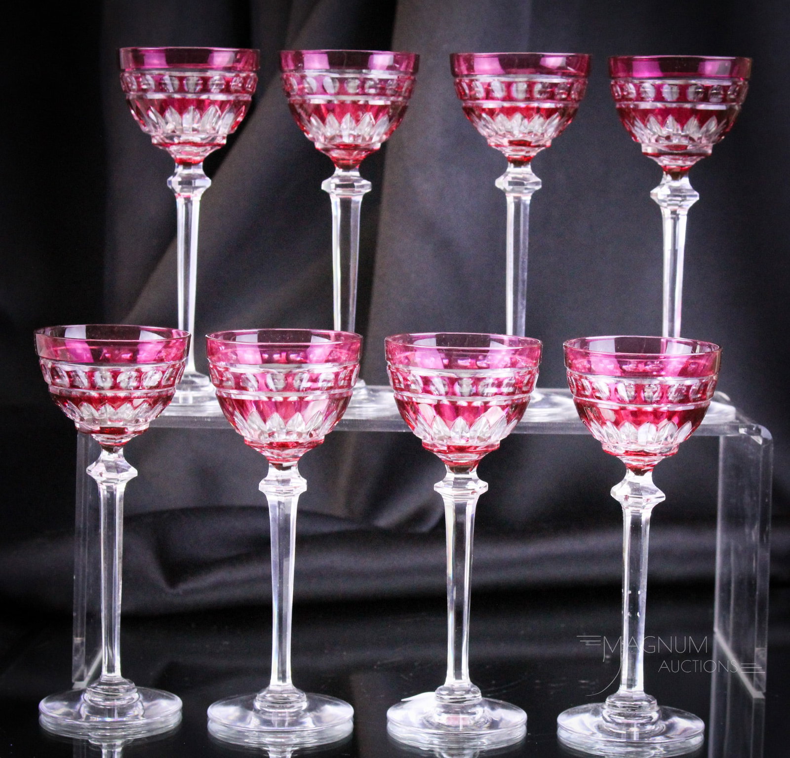8 pc Set Cranberry Cut to Clear Val St. Lambert Cordials: Fine cranberry cut to clear Val St. Lambert cordials make up this eight-piece set. Each measures 5 1/8" tall.