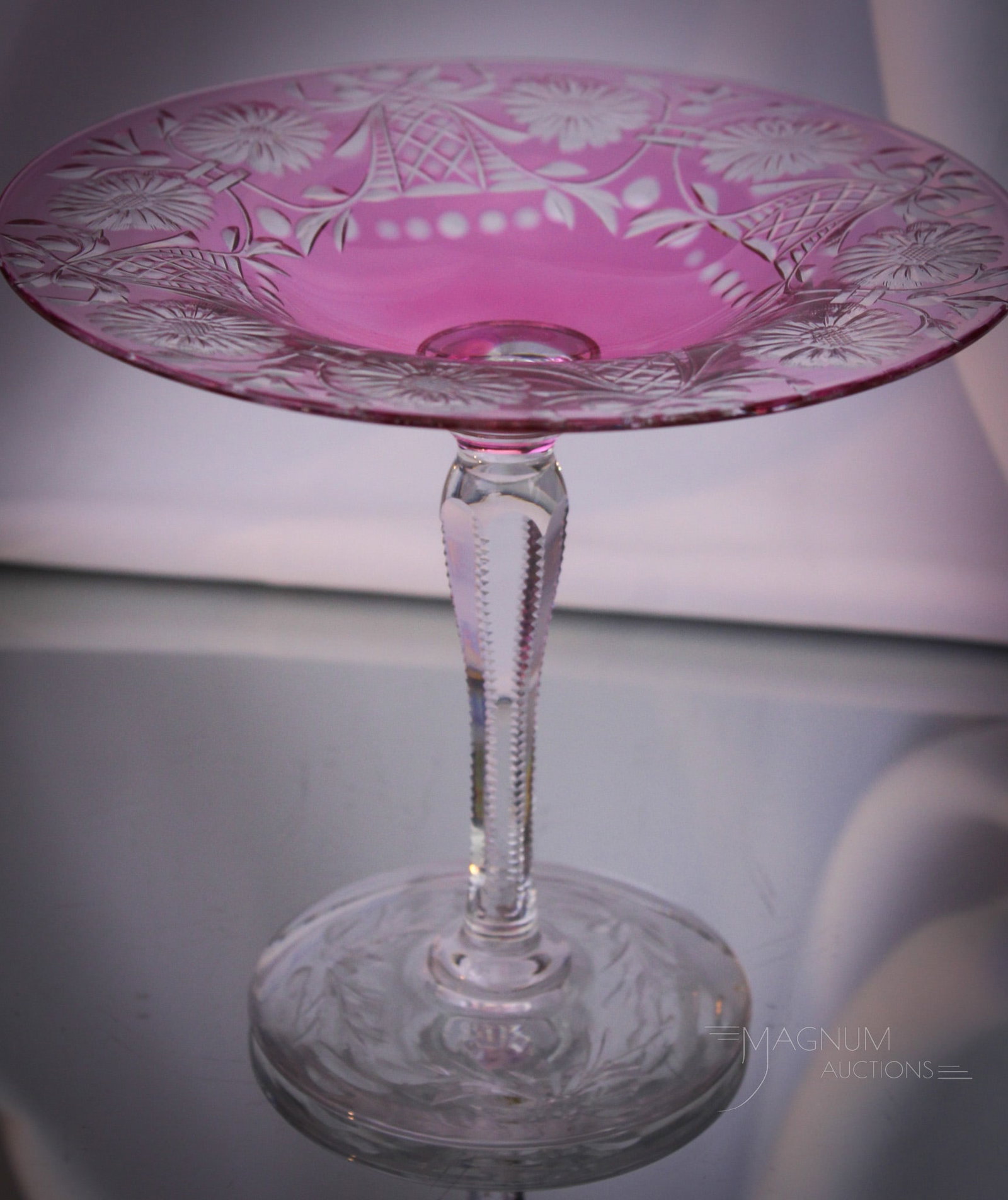 Signed Libbey Cranberry Cut Glass Compote: Amazing signed Libbey cut glass cranberry to clear compote with bows and flowers design and cut stem. Compote measures 6" tall, 6 3/4" in diameter.