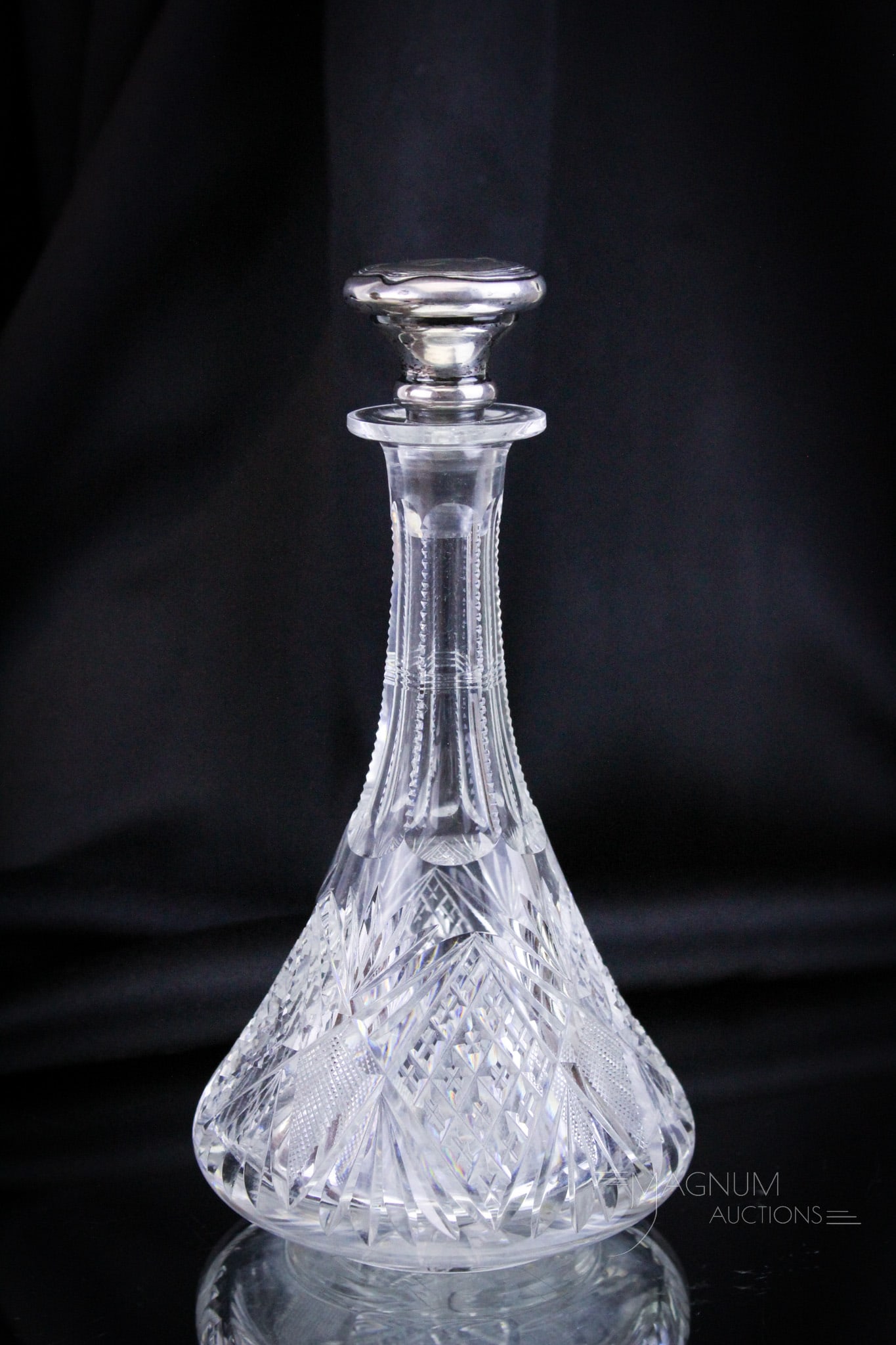 ABP American Brilliant Period Cut Glass & Sterling Cologne Bottle: Brilliant period cut glass cologne bottle complete with sterling stopper. Bottle measures 8" tall.