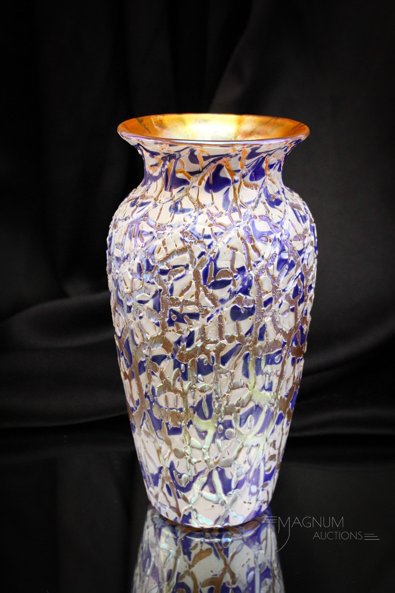Durand Moorish Crackle Art Glass Vase: Fine Durand Moorish Crackle art glass vase. Vase exhibits colors of blue, white, and gold. Vase has gold interior. It measures 9" tall.