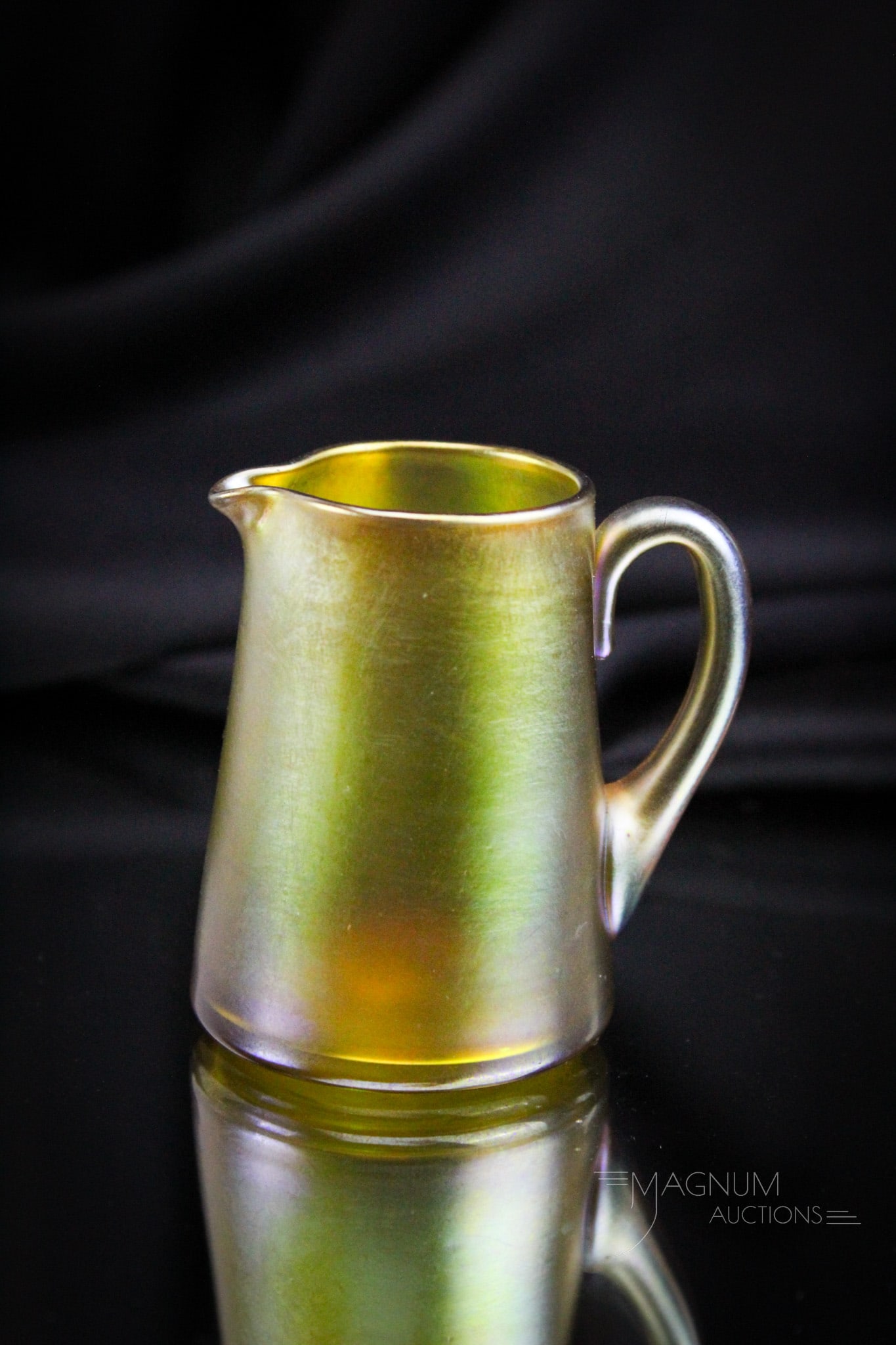 Signed Tiffany 2 1/2" Gold Favrille Art Glass Creamer: Such a sweet little piece of signed Tiffany art glass. This little creamer measures just 2 1/2" tall. It is signed on the base, "L.C.T." Provenance: This item is from the private collection of Bill & 
