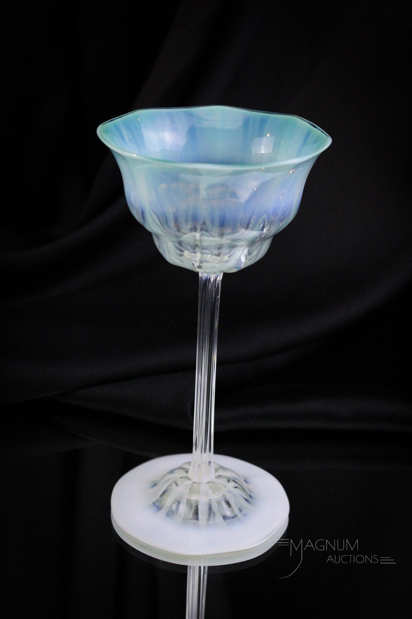 Signed Tiffany Favrile Green Pastel Opalescent 7 1/2" Stem: Finishing off our offering of pastel Tiffany is this signed green pastel opalescent stem that matches the previous two lots. This stem measures 7 1/2" tall. Piece is signed, "L.C.T., Favrile."