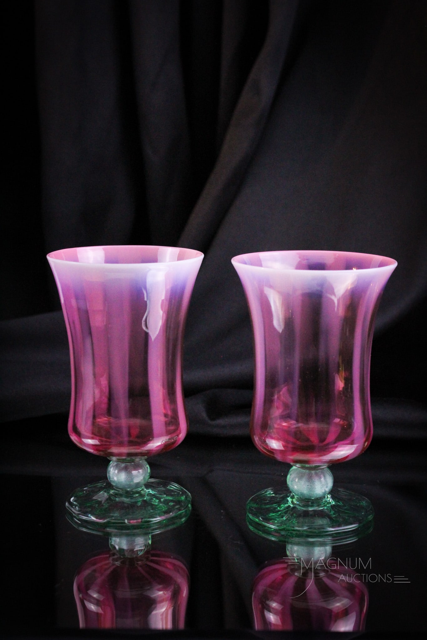 2 pc Lot Signed Tiffany Favrile Pastel Opalescent Art Glass 5" Tumblers: Two perfect examples of the beautiful pastel Tiffany we are offering. These two tumblers each measure 5" tall. Cranberry opal coloring with green applied foot. Each are signed, "112, L.C.T. Favrile."