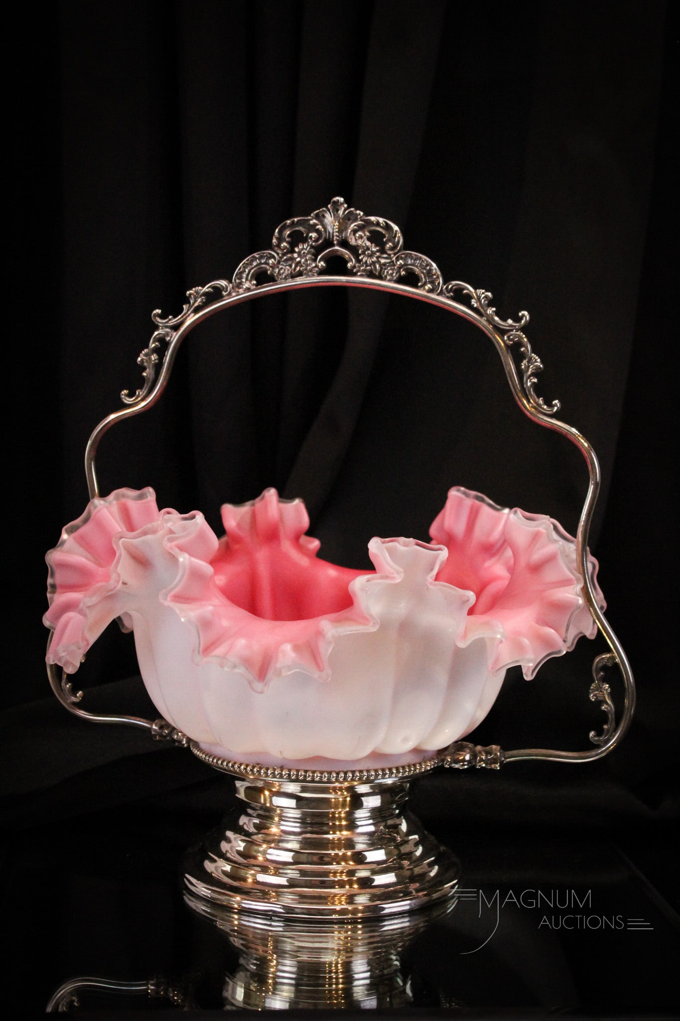 Warren Victorian Silverplate Large 13 1/2" Pink Cased Brides Basket Bowl: Wonderful offering of a large and characteristicly Victorian bride's basket in a signed Warren silverplate frame. Bowl is melon ribbed with pink cased interior. Complete it measures 13 1/2" tall, 12" 