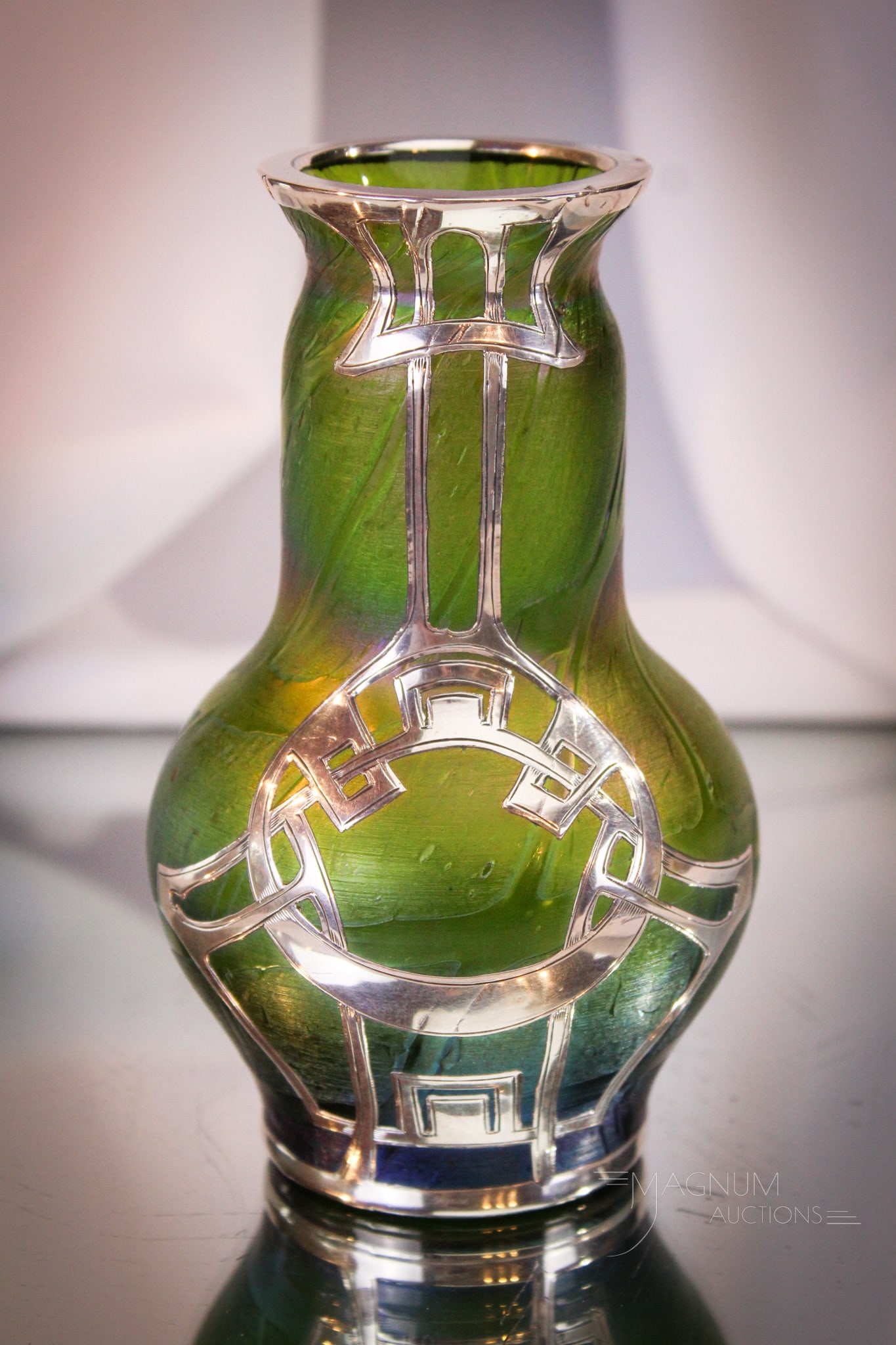 Loetz mkd Sterling Overlay Irridescent Art Glass Vase: Great example is this fine Loetz irridescent art glass vase with marked sterling overlay. Great example and nice size measuring 5 1/2" tall.