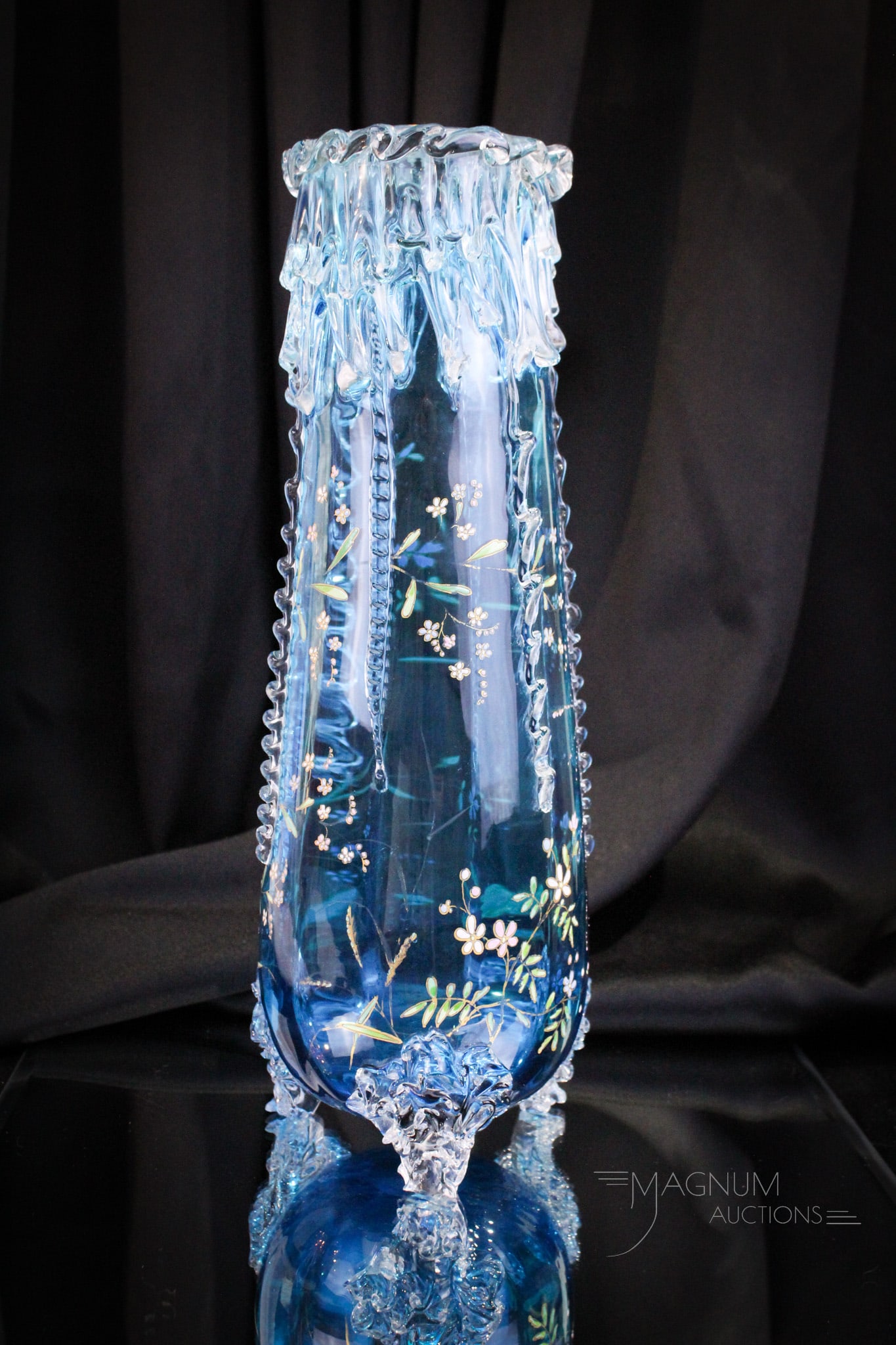 Bohemian Prussian Blue Victorian Art Glass Icicle 14" Vase: Grand piece of Bohemian Victorian glass in the form of a 14" tall icicle vase in Prussian blue glass with gilt and enameled decoration. Vase measures 14" tall.