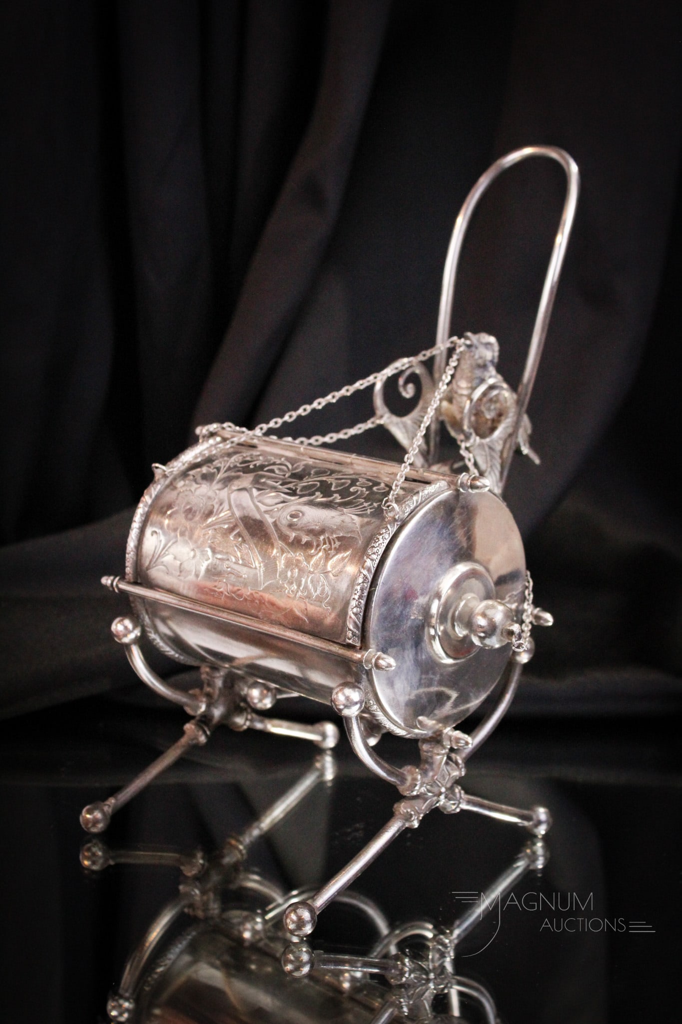 Victorian Silverplate Figural Mechanical Jewelry Casket: Wonderful Victorian silverplate mechanical jewelry casket with a cute bird perched at the top. Move the handle back to expose the pink-lined jewelry box. Complete piece measures 9 1/2" tall.