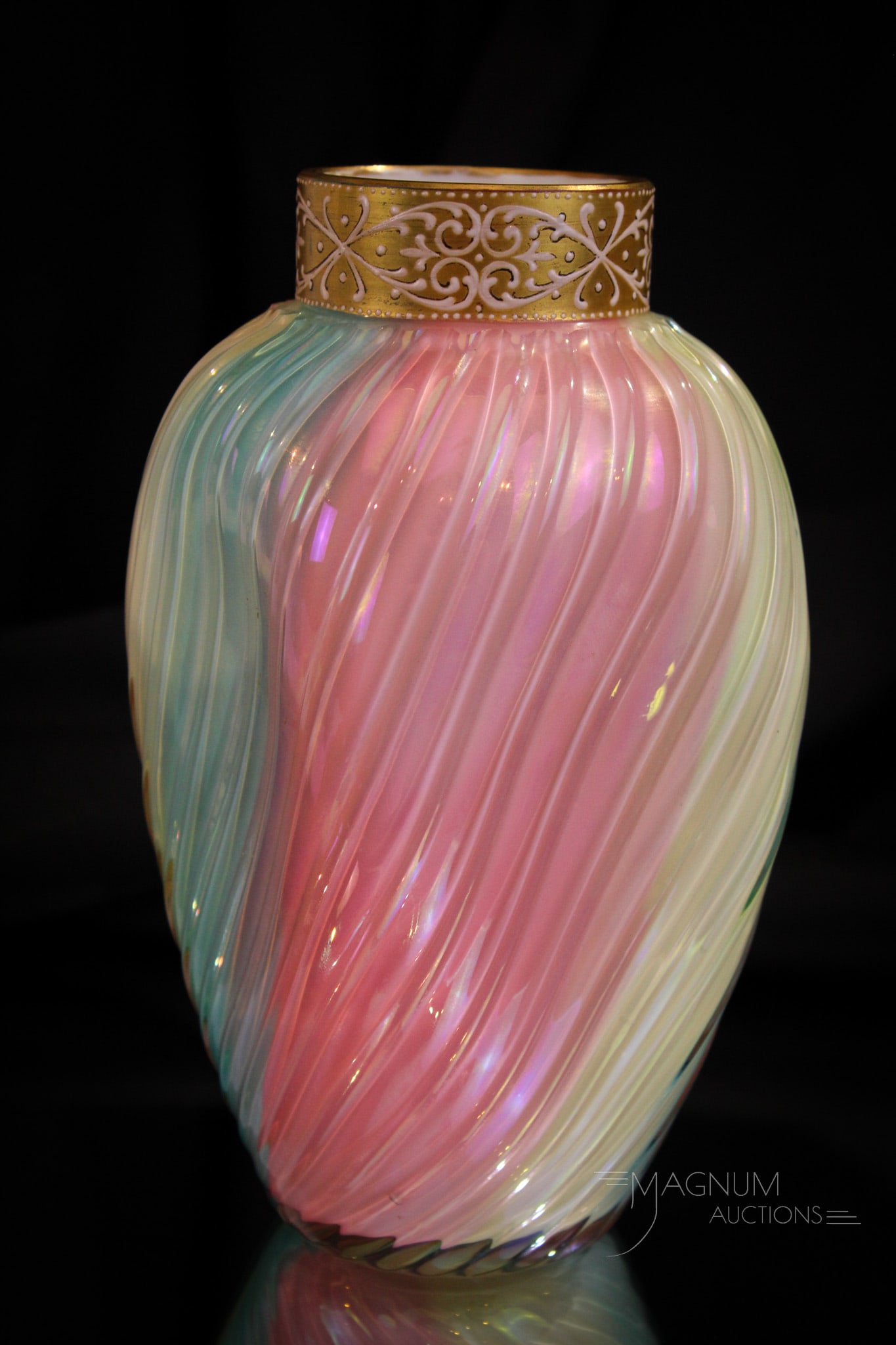 Loetz Rainbow Victorian Irridescent Art Glass Vase: Striking Loetz gilt irridescent rainbow Victorian swirl mold art glass vase. Vase features pinched sides. Gold band at top. Lovely example. Measures 7 1/2" tall.