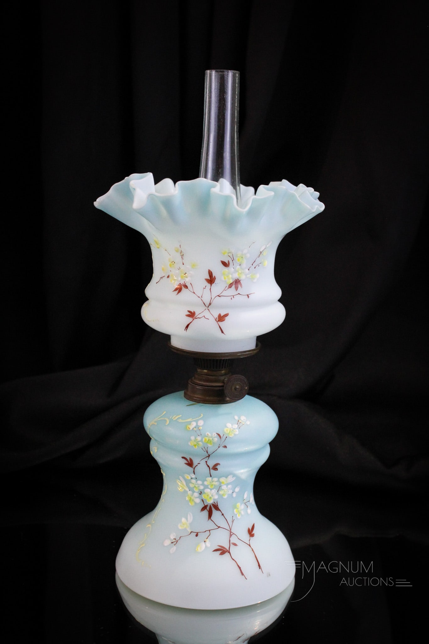 Victorian Satin Enameled Glass Minature Oil Lamp: Fine powder blue enameled Victorian glass miniature oil lamp. This one with enameled delicate florals. Nice form. Complete lamp measures 9" tall.