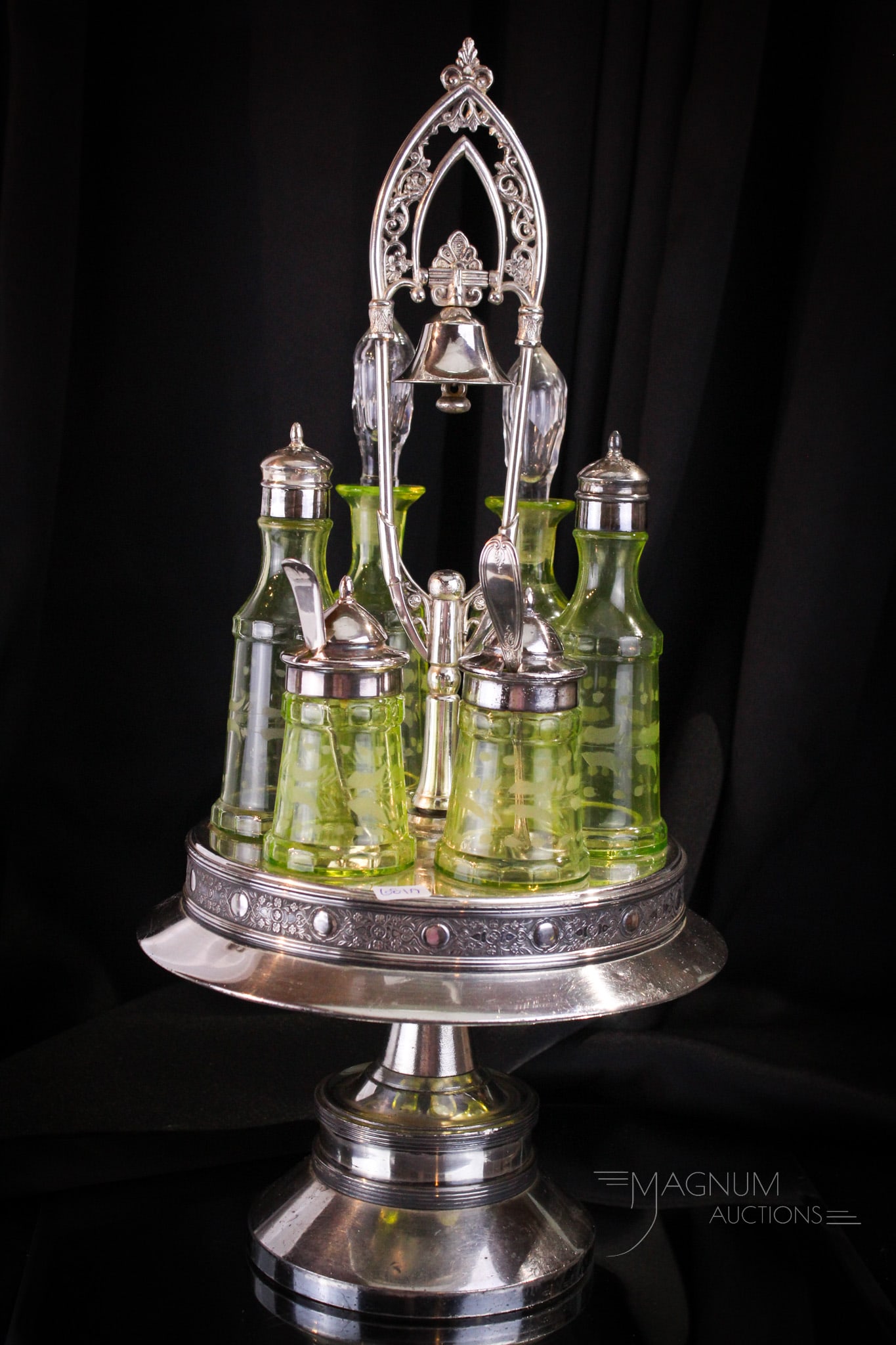 Wilcox Silverplate Victorian Vaseline Engraved 6 Bottle Cruet Condiment Castor Set: Beautiful find in this signed Wilcox silverplate Victorian condiment castor. Holder features a call bell for ringing for the butler. Set is complete with six vaseline engraved bottles. Complete it mea