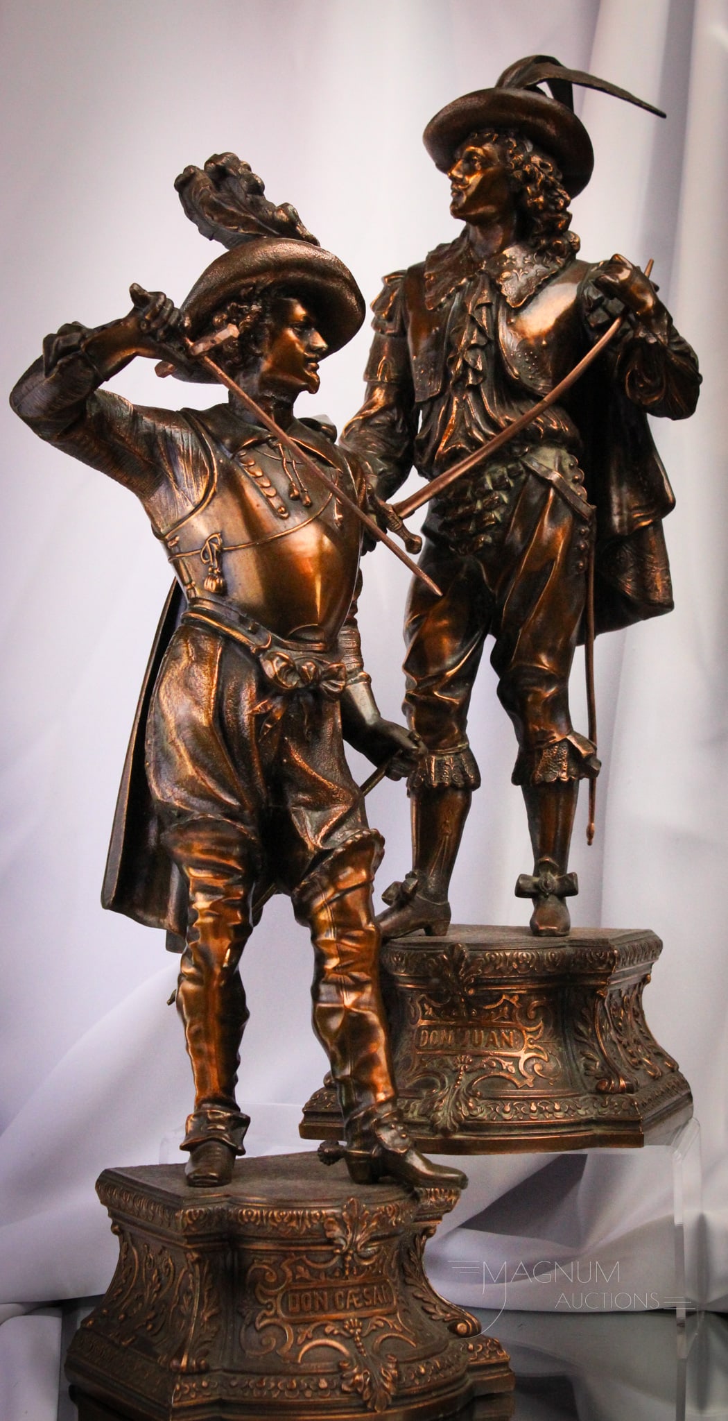 Pair 21" Bronzed Spelter Victorian Don Caesar and Don Juan Mantle Statues: Fine offering of a pair of bronzed patina Victorian spelter statues featuring Don Juan and Don Caser. Each complete with swords. Tallest measures 21 1/2" tall.