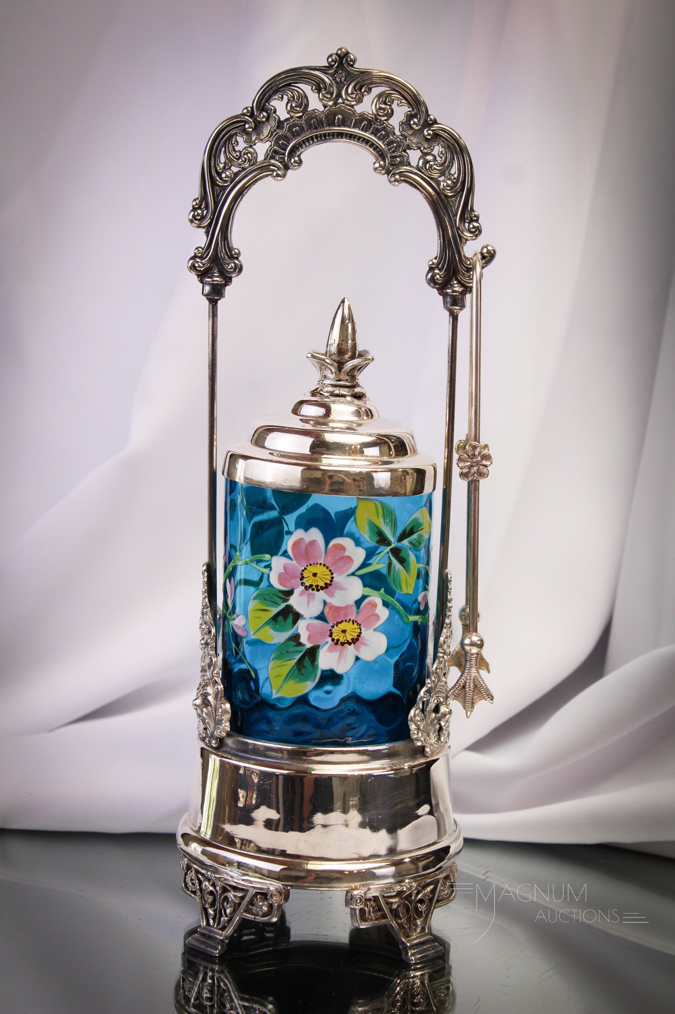 Weston Victorian Silverplate Blue Enameled Pickle Castor: Fine signed G. Weston Victorian silverplate pickle castor frame complete with vivid blue enameled florals decorated insert. Complete castor measures 13 1/4" tall to the top of the handle.