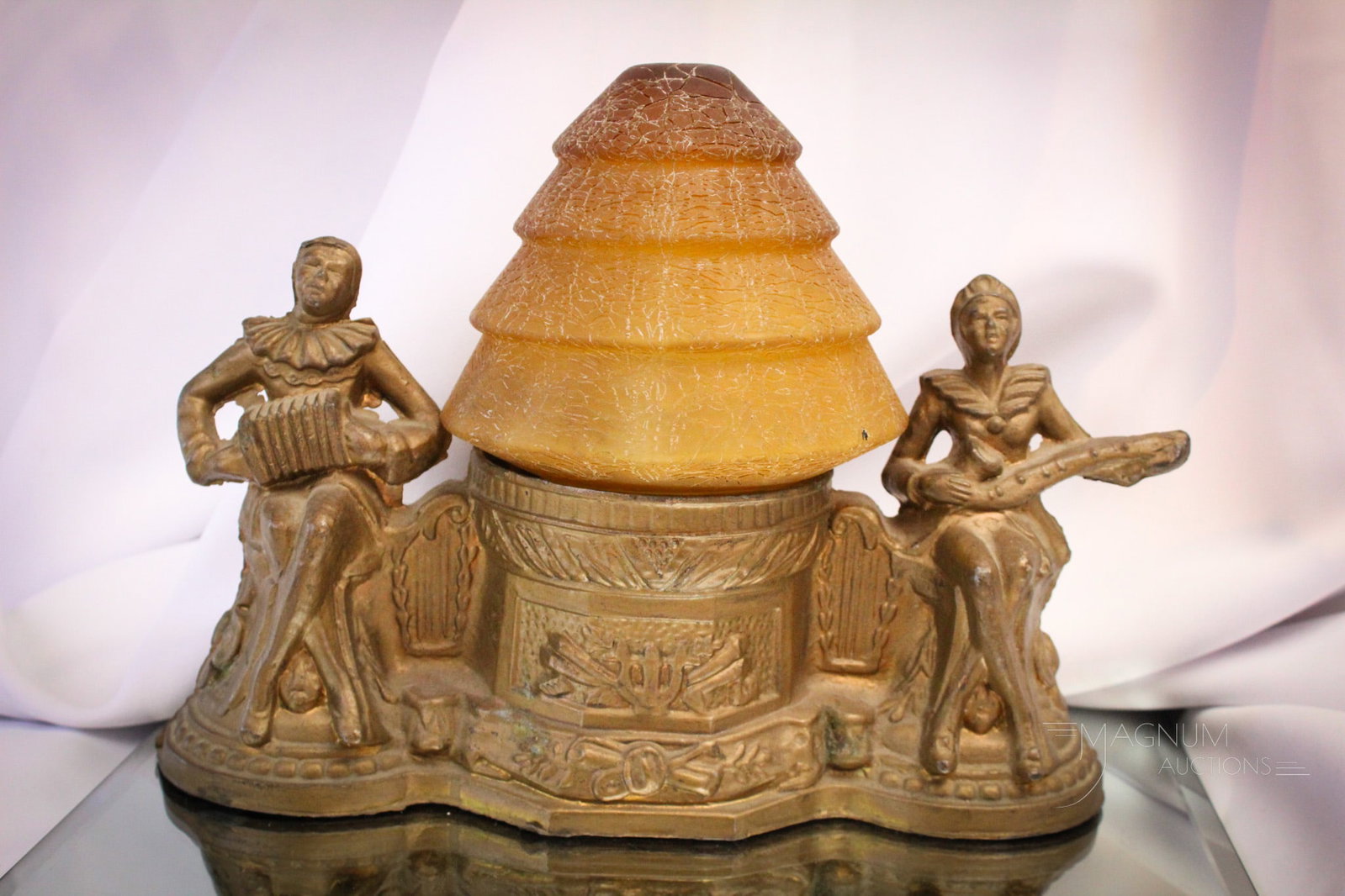 Art Deco Spelter Antique Minstrels Lamp: Fine offering of an Art Deco radio lamp complete with original amber craquelle glass shade. Lamp measures 8 1/2" tall, 12" long.