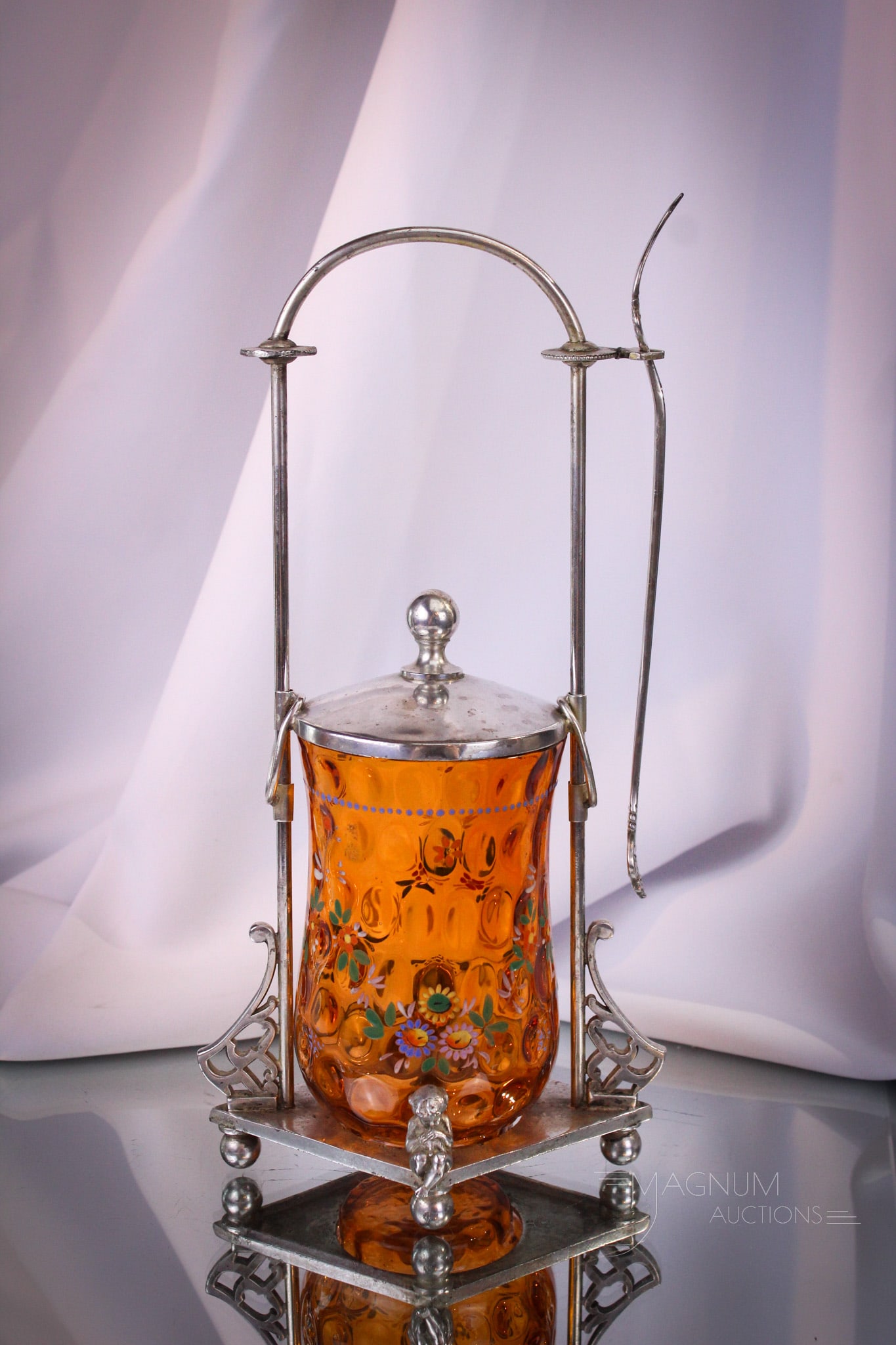 Webster Victorian Silverplate Tangerine Enameled Mechanical Pickle Castor: Beuatiful and unusual Victorian putti adorned mechanical Webster signed silverplate pickle castor. Castor is complete with tangerine enameled thumbprint jar. Mechanical lid slides up on the frame hand