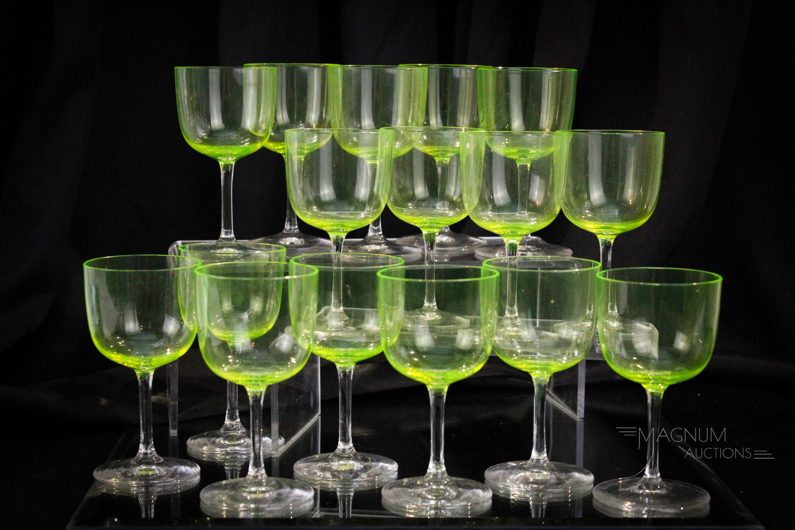 16 pc Lot Art Deco Glass Vaseline Cherry Stems: Fine offering of 16 vaseline and clear Art Deco period cherry stems. Each a materful piece of art glass. Each measures 4 1/2" tall.