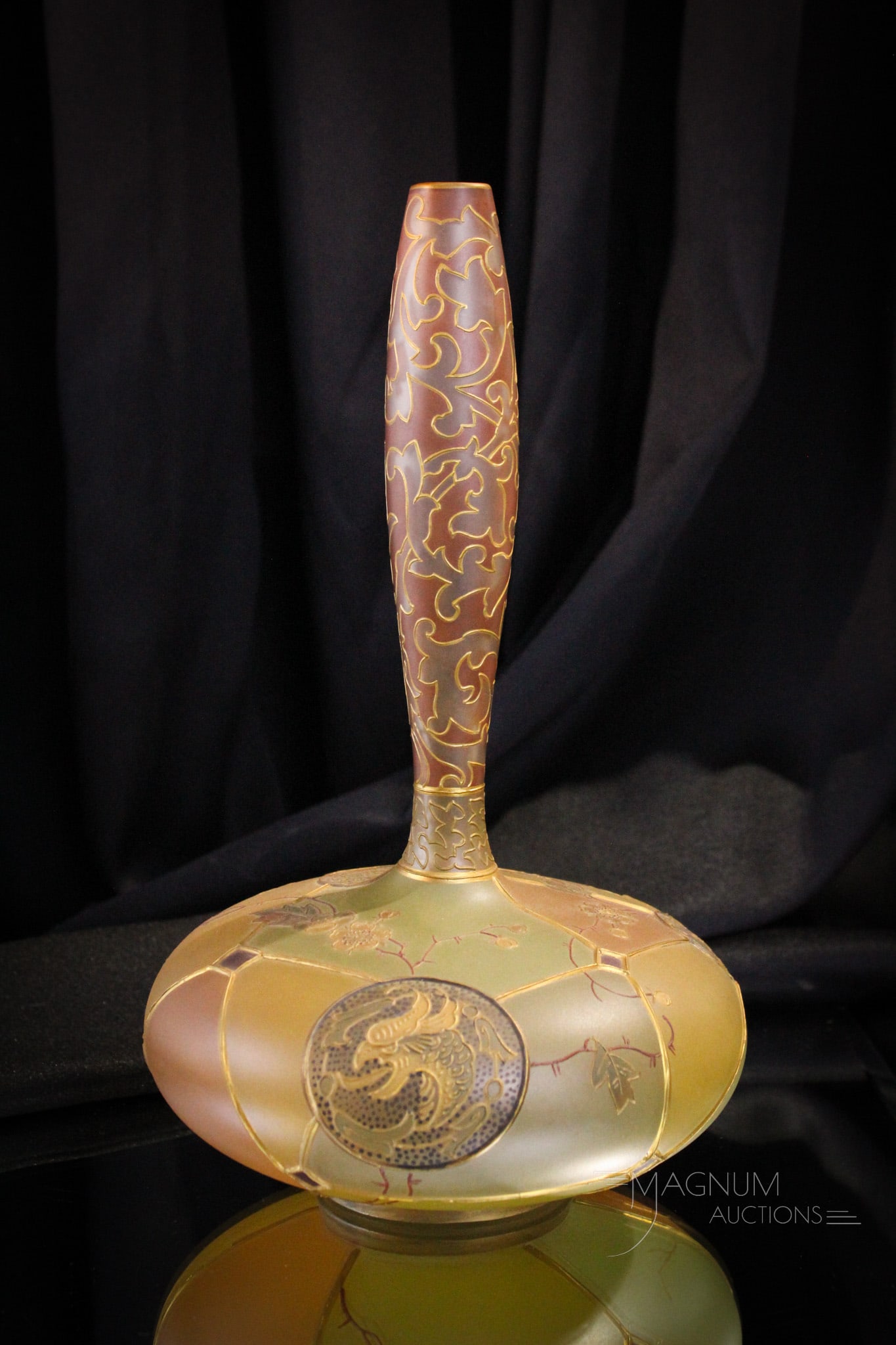 Mt. Washington Royal Flemish Victorian Glass Vase: Beuaitful and classic form Mt. Washington glass Royal Flemish line vase. Vase in a genie bottle form with circular motif and dragons within the design. Vase measures 11" tall. Provenance: This item is