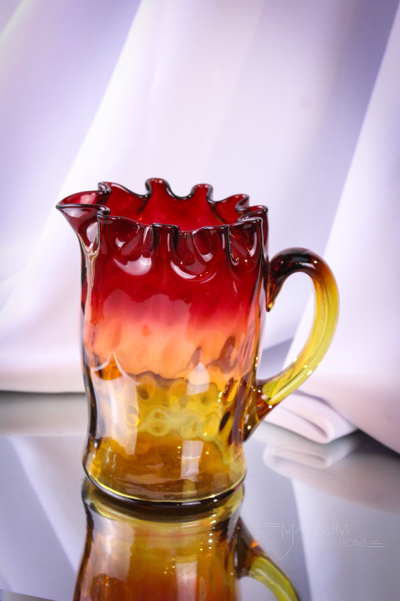 Mt. Washington Amberina Winchester Victorian Glass Pitcher: Rare find in this form of a Mt. Washington Victorian glass pitcher. This one in the Winchester pattern with corset body and crimped rim. Pitcher measures 6" tall. Provenance: This item is from the pri