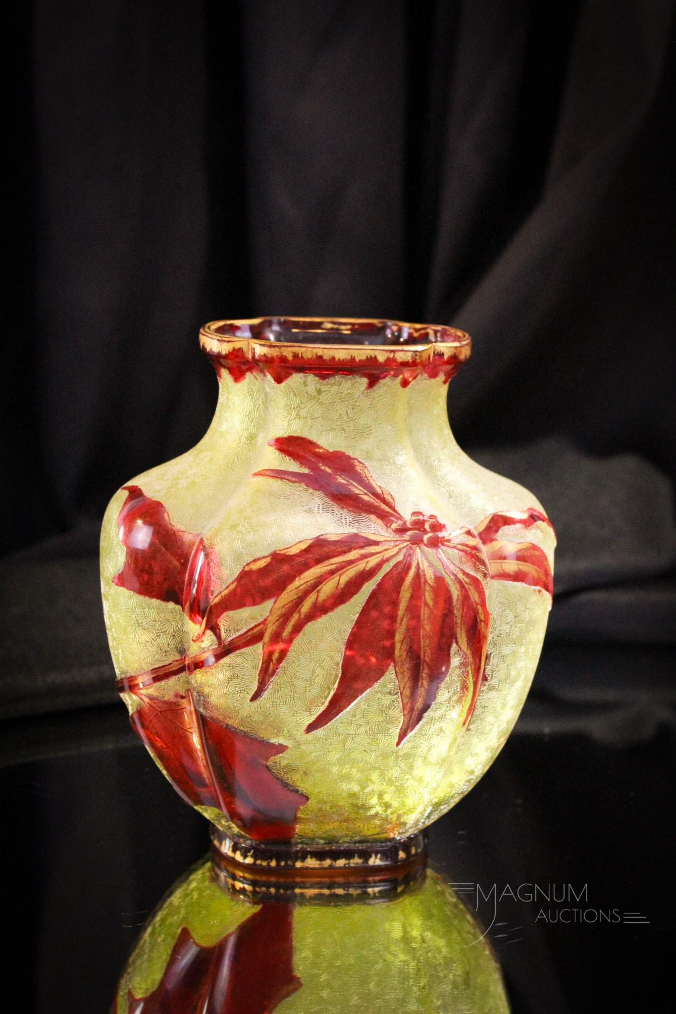 Baccarat Acid Cutback Cameo Cranberry Citron Glass Poinsettia Vase: Very pretty and deeply cutback attributed to Baccarat cameo glass vase. Vase is cranberry cut back to citron. Piece is enhanced with gilt highlights. Fine example that measures 6" tall.