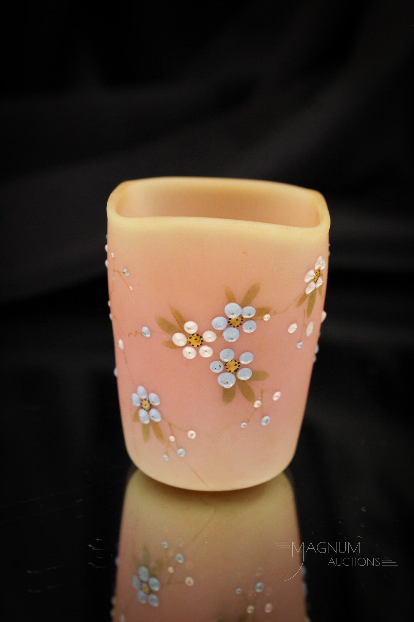 Mt. Washington Burmese Floral Decorated Victoain Glass Toothpick Holder: Such a nice example of the beautiful toothpicks made by Mt. Washington glass. This one in burmese glass with delicate florals. Toothpick holder measures 2 3/8" tall. Provenance: This item is from the