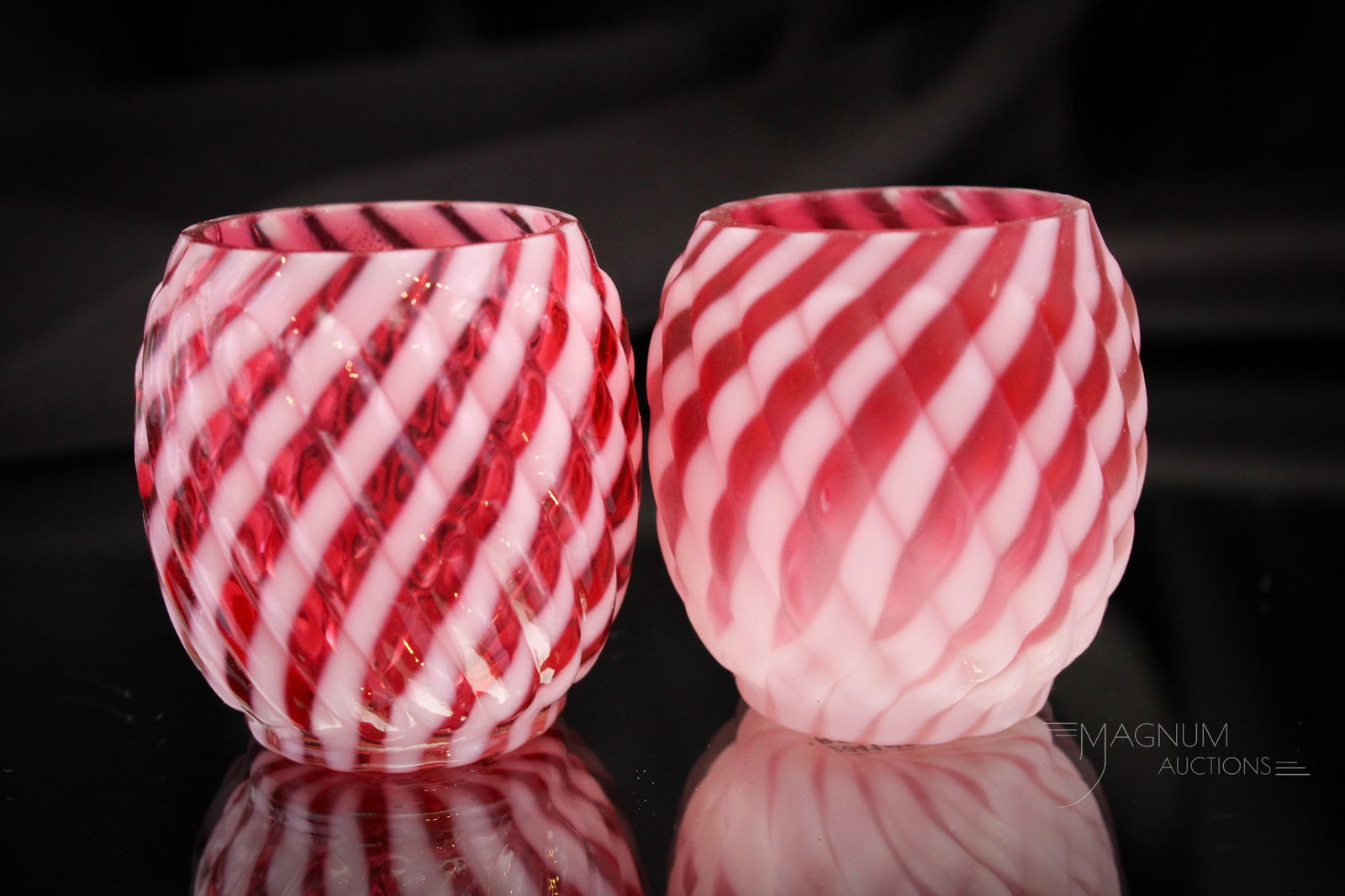 2 pc Lot Cranberry Opalescent Satin & Glossy Reverse Swirl Toothpick Holders: Two great examples of the Reverse Swirl pattern in cranberry opalescent Victorian glass. One in satin finish. One is glossy. Both very nice examples. Each measures 2 1/4" tall.