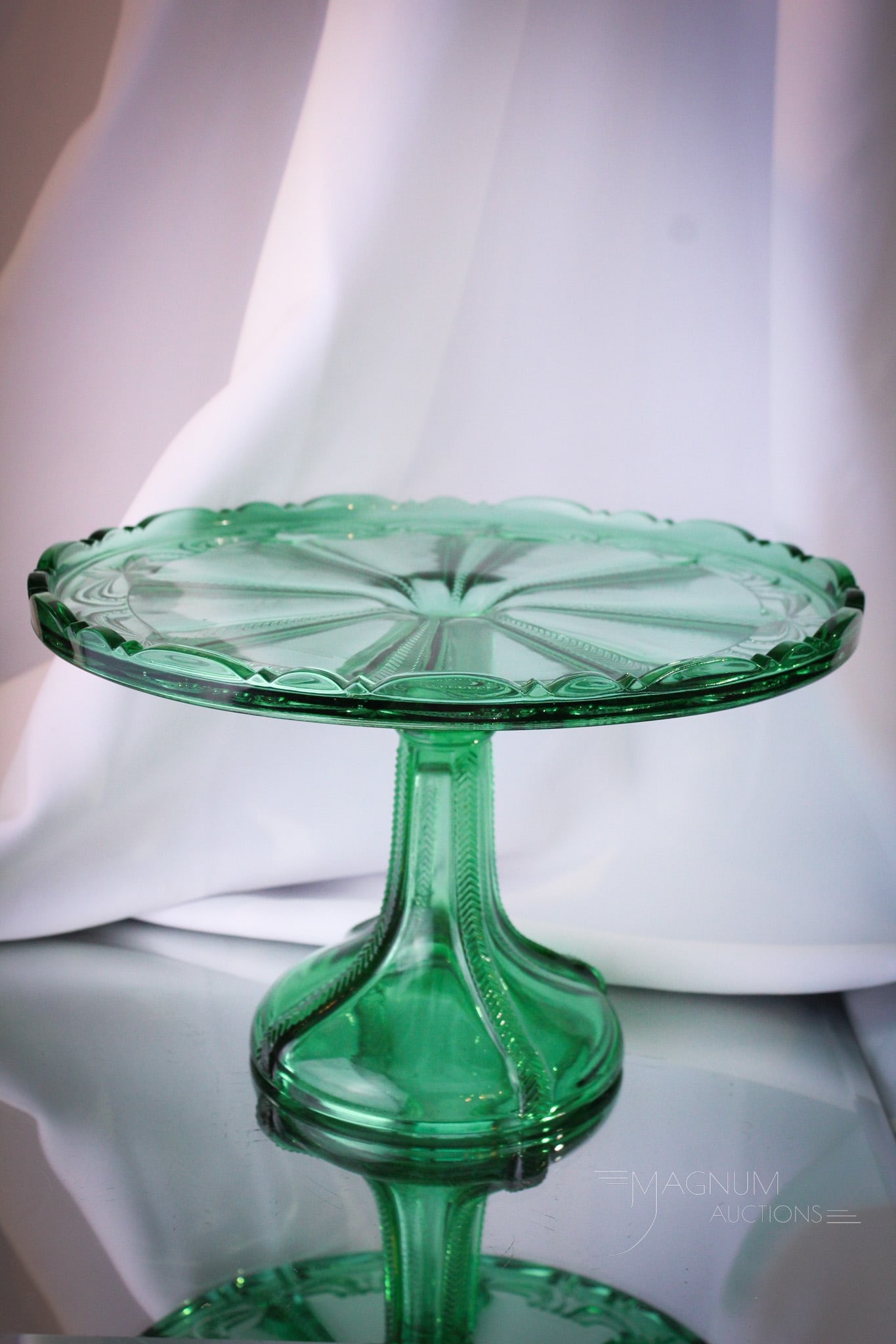 Scarce Greentown Herringbone Buttress Green Cakestand: Beautiful piece of Greentown glass. This is a Herringbone Buttress Victgorian teal green cakestand. Very nice. Piece measures 6 1/2" tall, 10 1/4" in diameter.