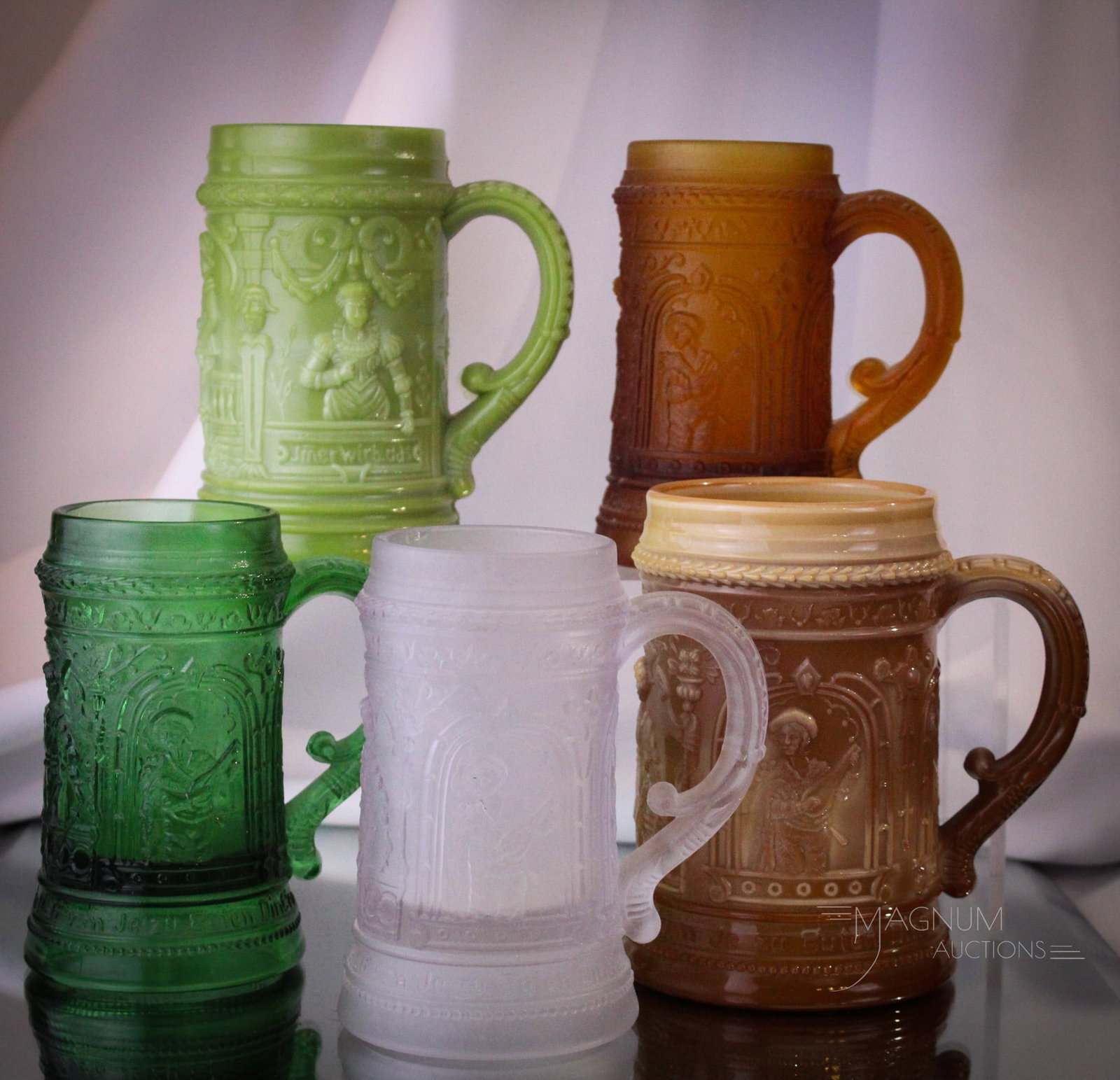 6 pc Lot Greentown Glass & More Mugs: Nice array of colors in this more than generous grouping of Greentown glass mugs. Something that will be sure to please. Tallest measures 5" tall.