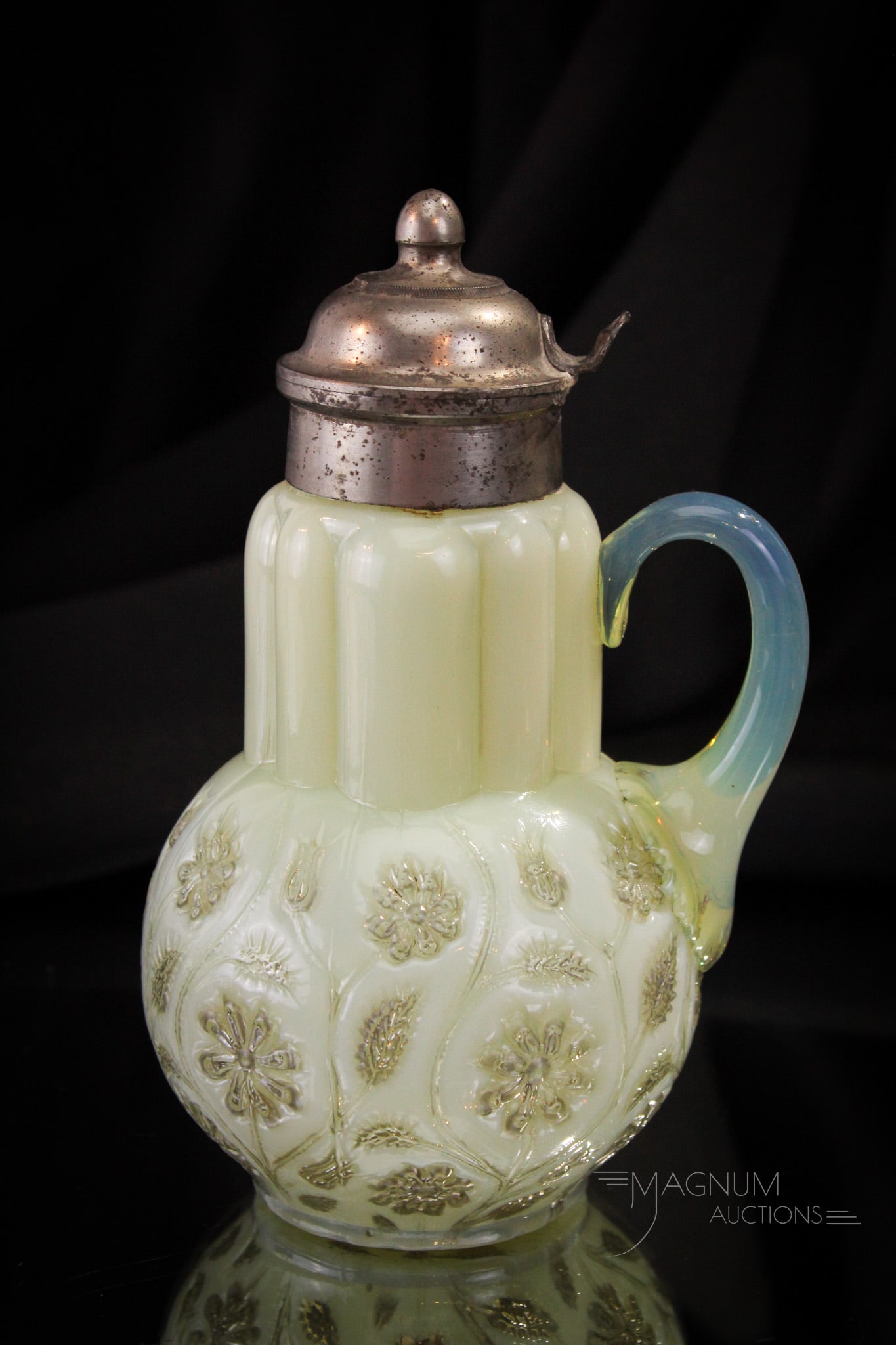 Victorian Findlay Onyx Glass Syrup Pitcher: Always a delight to find. This is a wonderful example of a Findlay Onyx Victorian syrup Pitcher. Nice coloring around on this one. It measures 7" tall.
