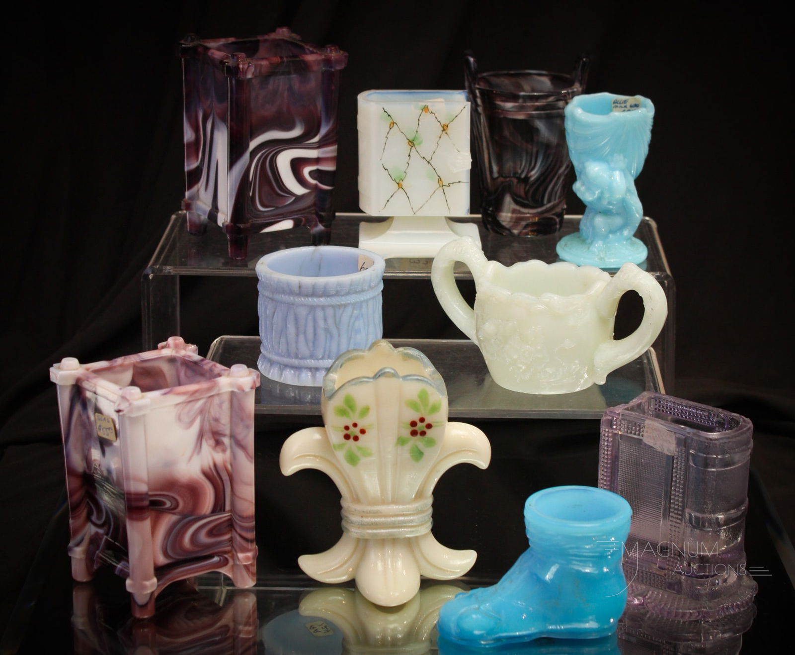 10 pc Lot Victorian Slag Glass & More Victorian Glass Toothpick Holders: Selections abound in this fine offering of Victorian glass toothpick holders in opaque and slag and more colorations. Tallest measures 4". Sun purple example with chip and also the purple slag has chi