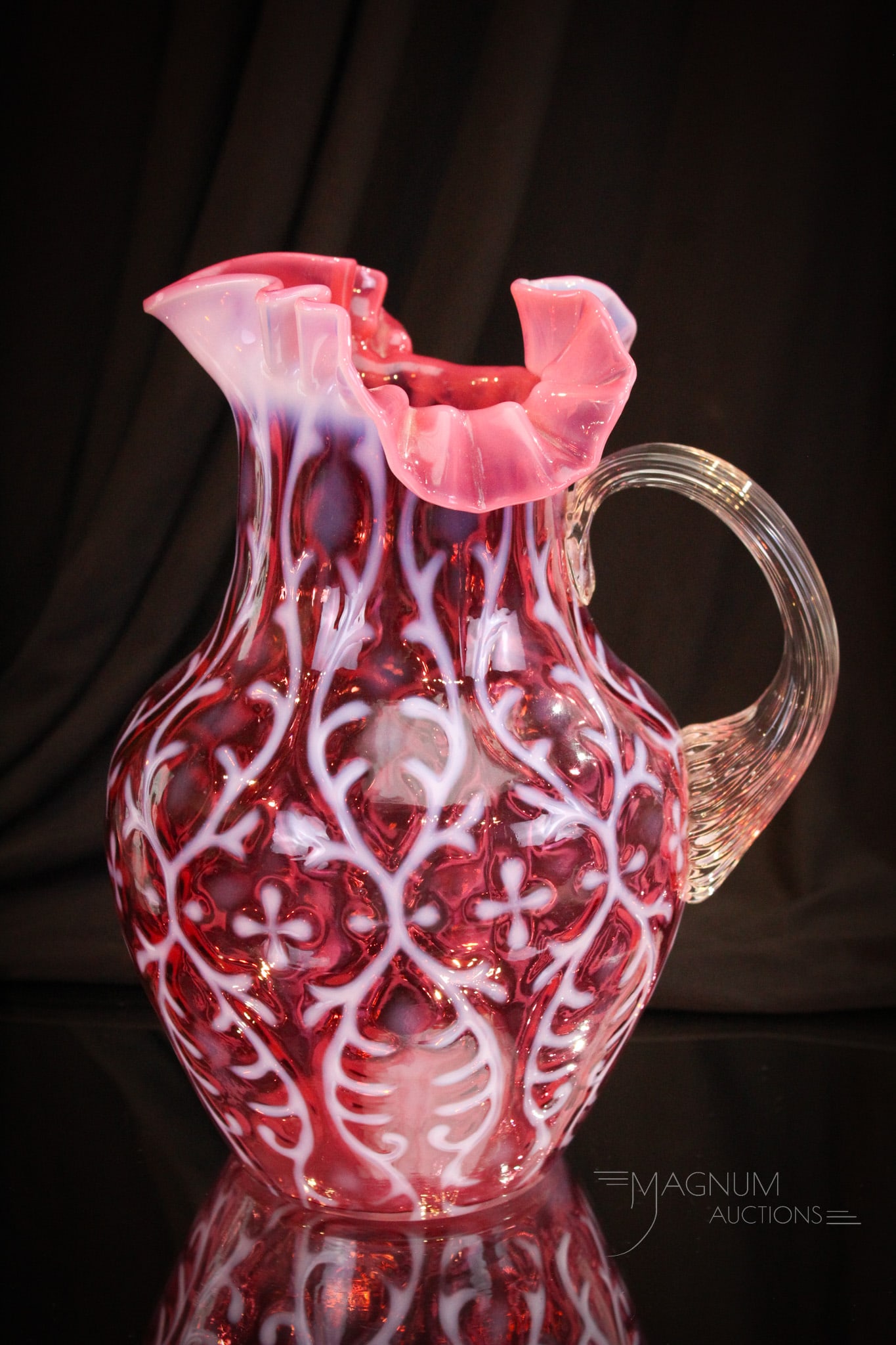 Northwood Cranberry Opalescent Spanish Lace Victorian Water Pitcher: Deep rich cranberry color makes up this fine Victorian Northwood water pitcher. This one is a stand out piece! Pitcher measures 9 3/4" tall.