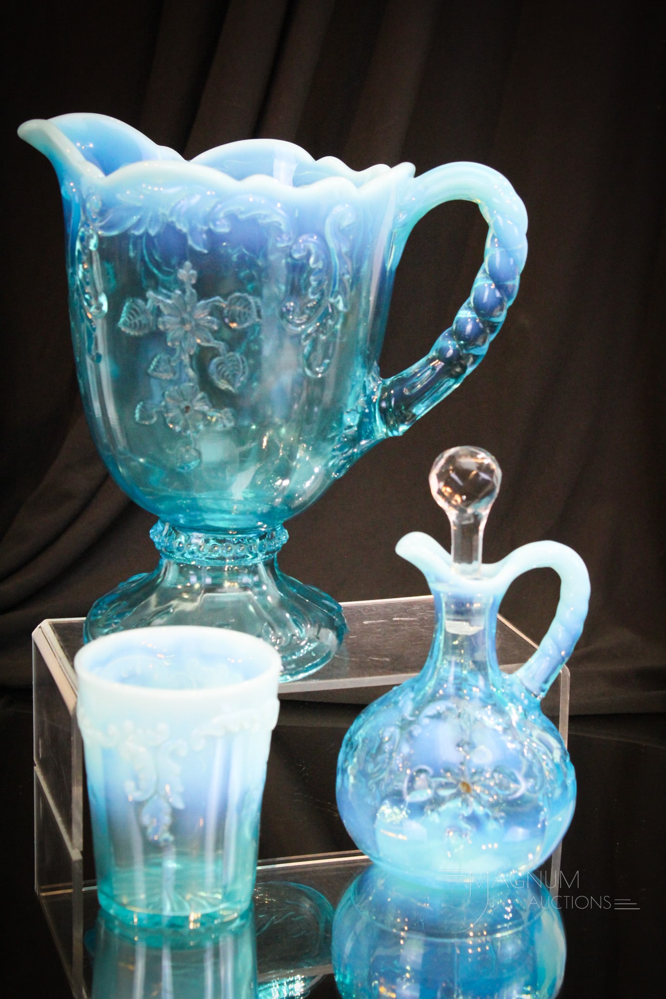 3 pc Lot Blue Opalescent Northwood Intaglio Glass: Three fine and desirable examples of Northwood Blue Oopalescent Intaglio pattern. Featured in this lot is a cruet, a water pitcher, and a tumbler. All very nice with great color and opal. Tallest meas