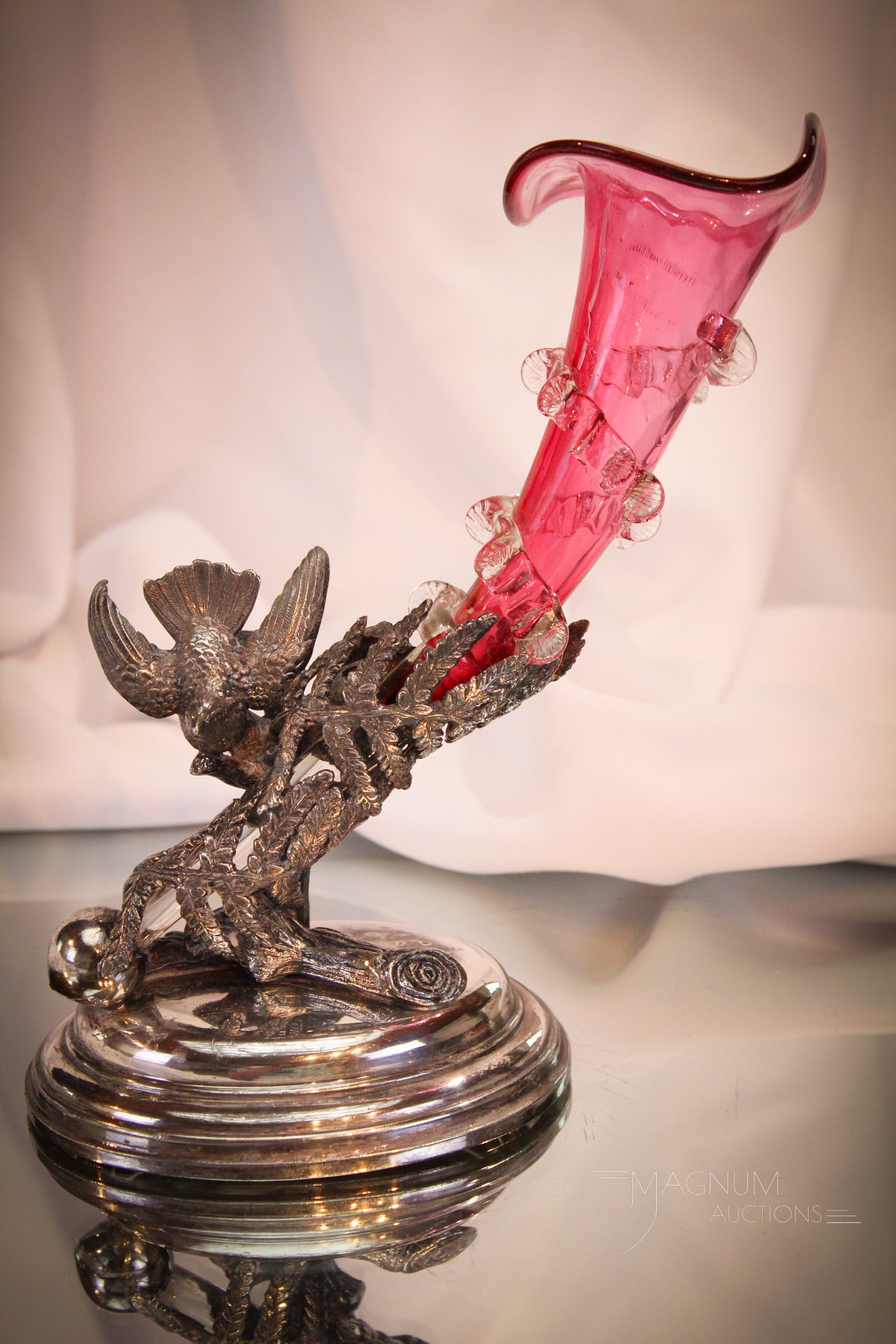 Meriden Silverplate Figural Cranberry Bud Vase: Fine offering of a figural signed Meriden silverplate bird with cranberry applied rigaree vase. Complete this wonderful piece measures 8 1/4".