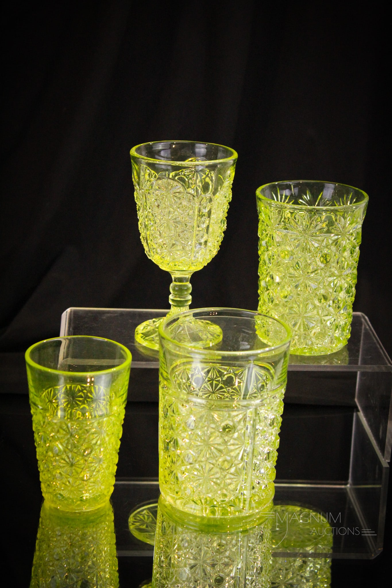 4 pc Lot Victorian Vaseline Glass: Four fine examples sure to please in this generous offering of vaseline Victorian glass. Three various Daisy & Button patterns in tumblers along with a footed cordial or wine. Tallest is 4 3/4".