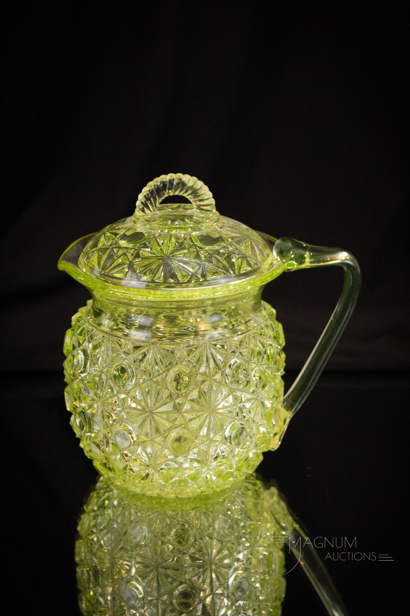 Rare Form Vaseline Victorian Lidded Creamer: A rare find is this Victorian vaseline glass lidded creamer in the Daisy & Button pattern complete with matching lid. Creamer has unusual applied handle. Complete it measures 5" tall.