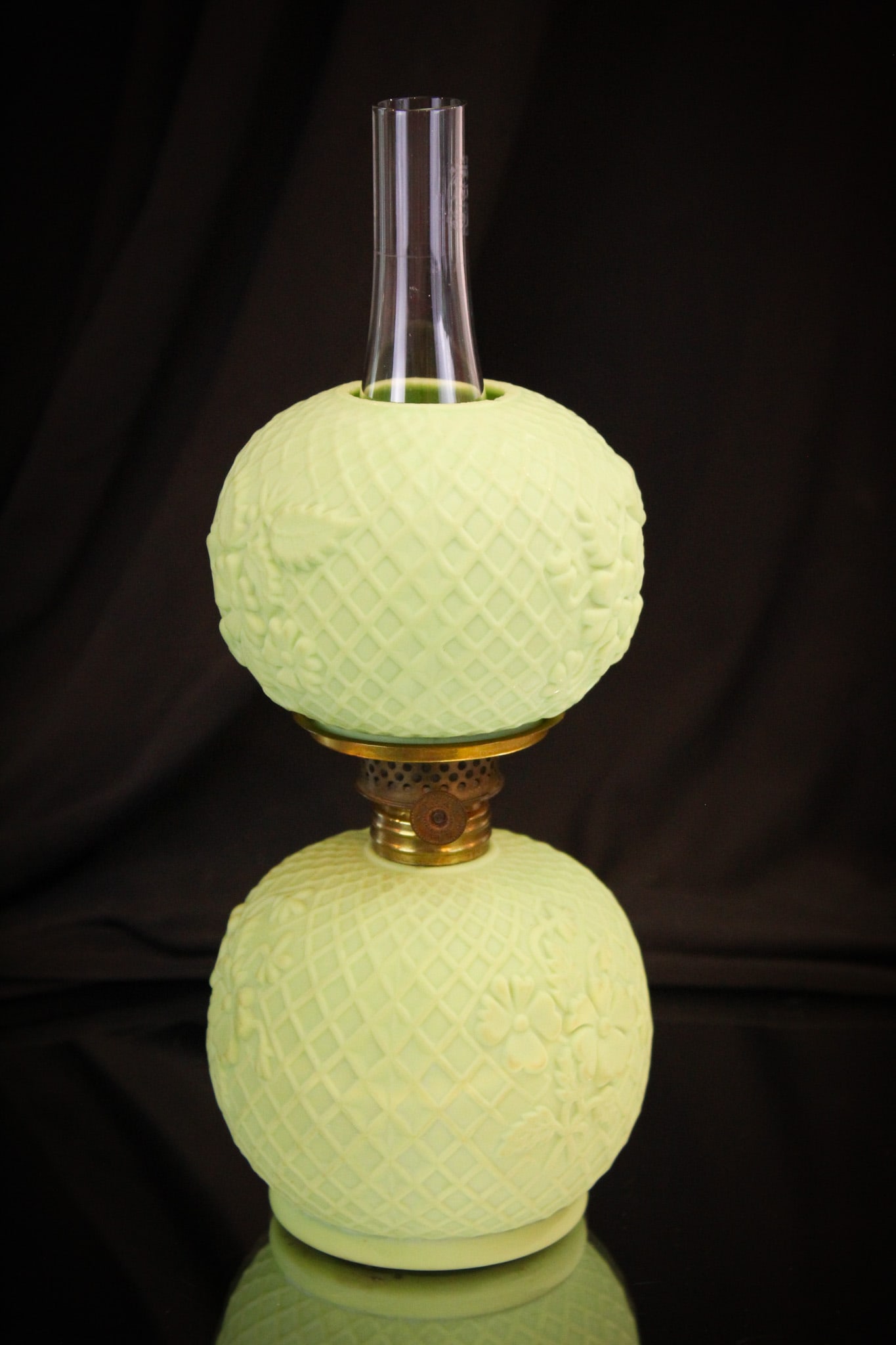 Green Opaque Victorian Netted Dogwood Miniature Oil Lamp: Lovely green opaque glass Victorian miniature oil lamp in the Netted Dogwood pattern. This gem is a must have for any miniature lamp collector. Lamp measures 7 1/2" tall.