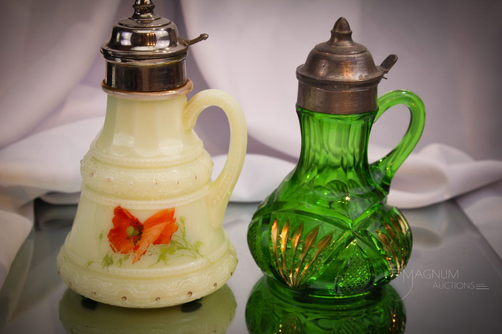 2 pc Lot Heisey Glass Victorian Syrup Pitchers: Two nice finds in Victorian glass Heisey patterned syrups. One in emerald green in the Pineapple & Fan pattern. The other in Ring Band pattern with decoration.
