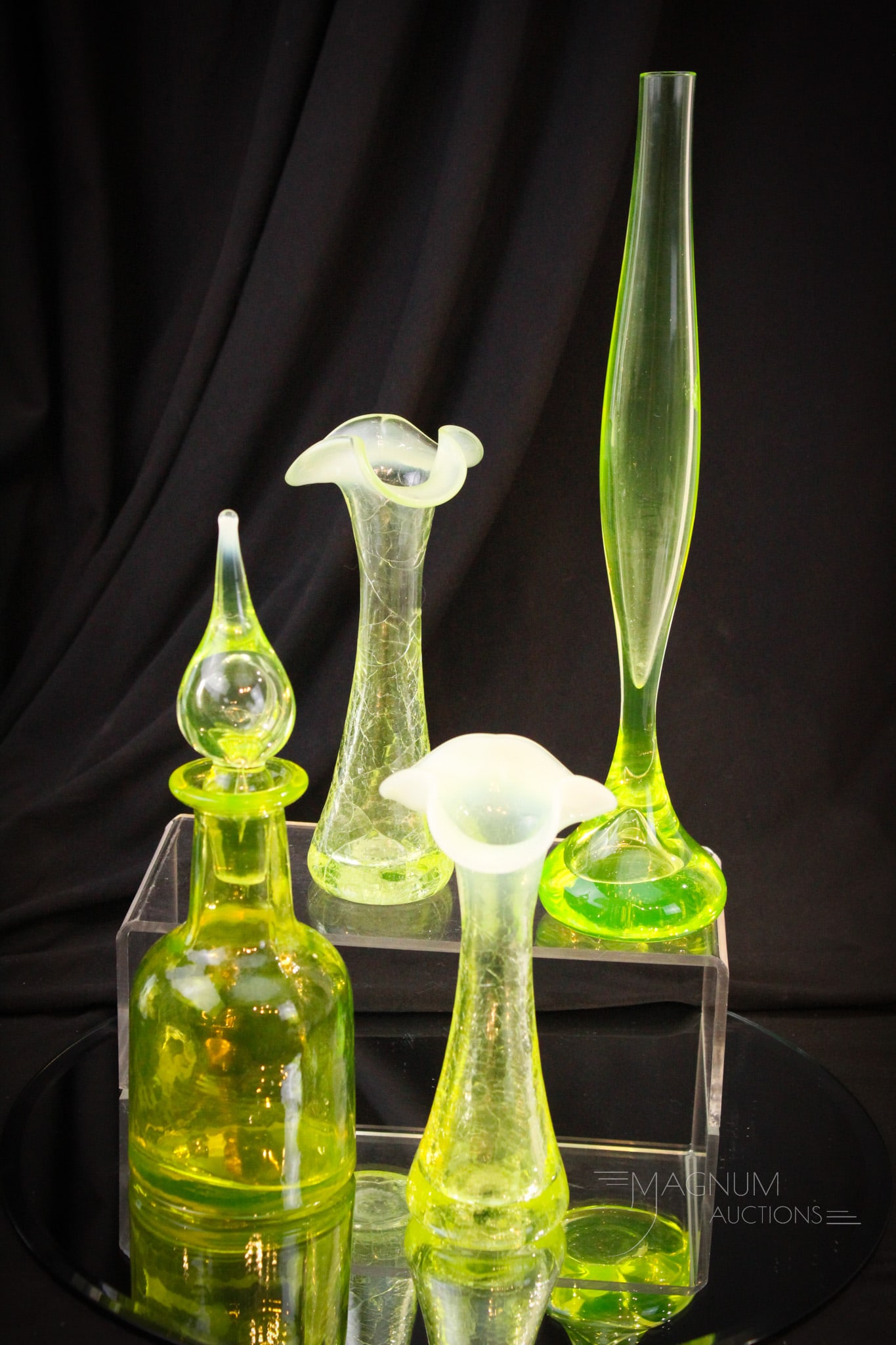 4 pc Lot Contemporary Vaseline Glass Gibson & More: Four fanciful delights sure to be collection enhancing. Offered in this lot is a pair of Gibson vaseline opalescent crackle glass vases. These along with a vaseline bottle with a wee touch of opal at