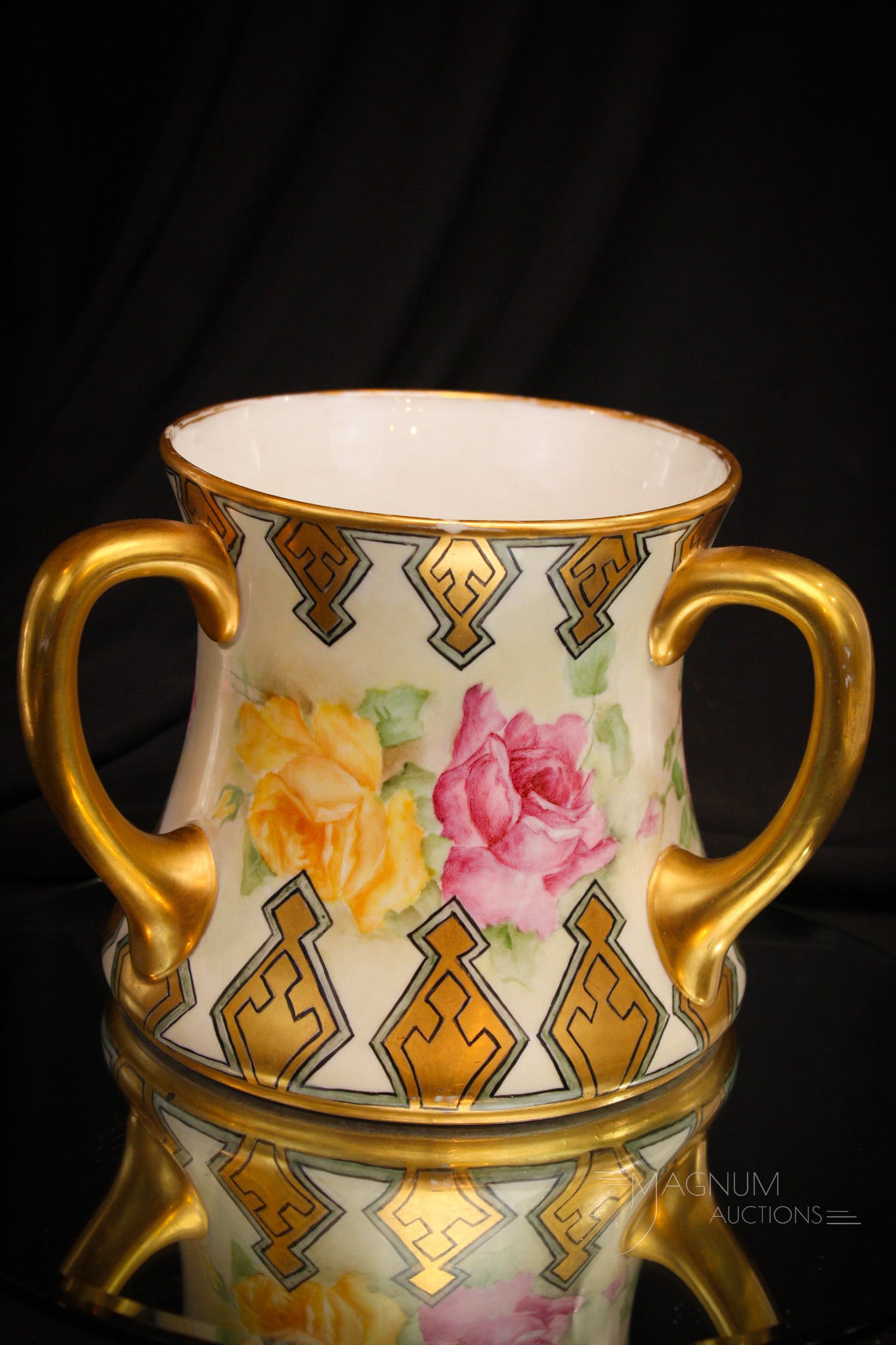 Limoges France Hand Painted Porcelain 3-Handle Roses Loving Cup: A find among the offerings we have here. This fine three handled loveing cup is graciously adorned with a bounty of roses and gilt decoration. Piece measures 6" tall.
