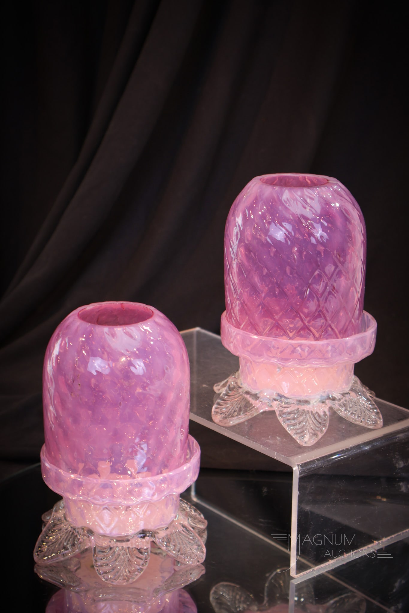 Pink Opalescent Diamond Quilt Fairy Lamp Pair: Two matched examples of pink opalescent Victorian glass diamond quilt fairy lamps complete on orignal matching bases with applied leaf feet. Each measures 5" tall.