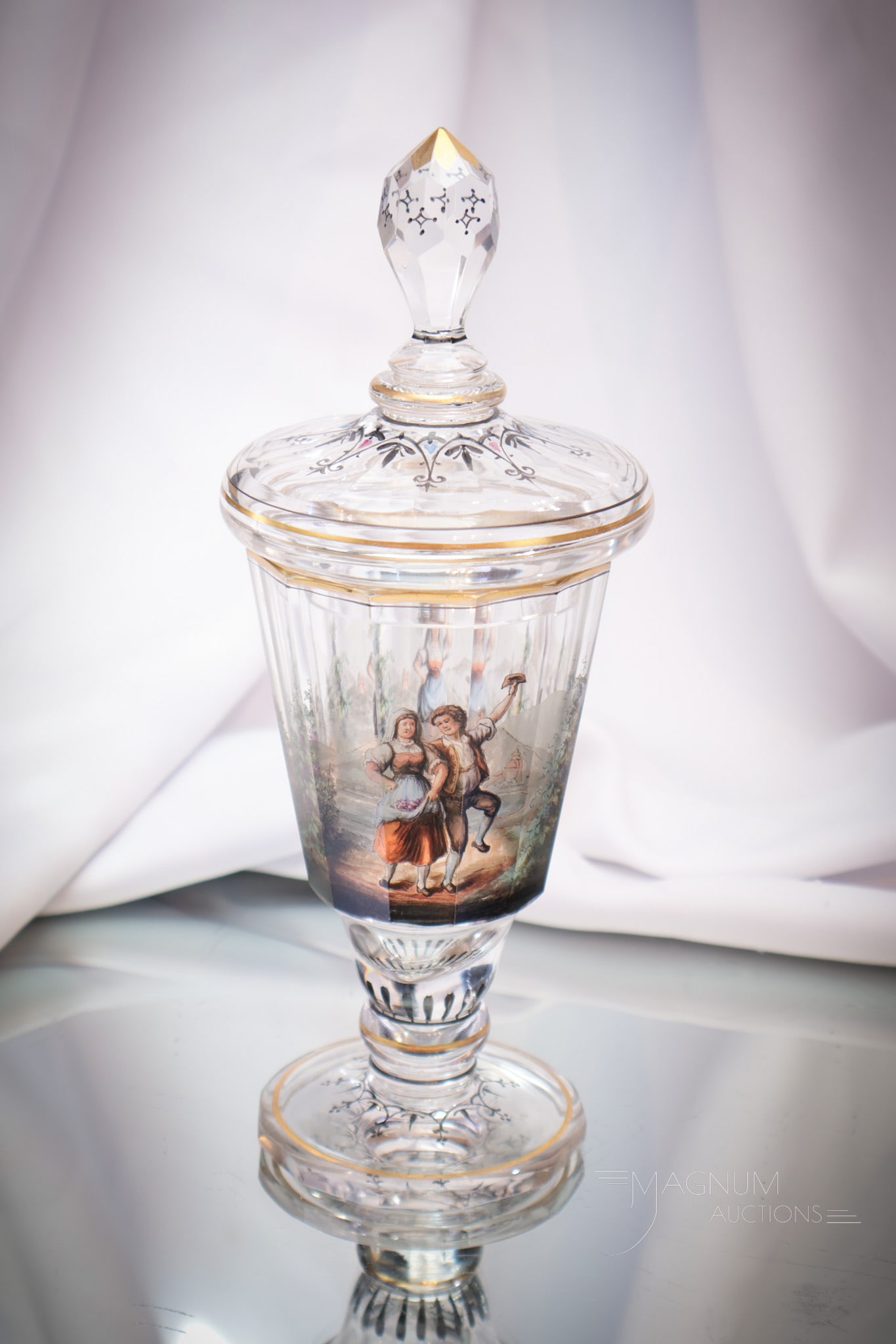 Lobmeyr Diminutive Enameled Glass 9" Pokal: Select offering of a covered pokal featuring scenic decoration. Attributed to Lobmeyr. This pokal measures 9" tall.