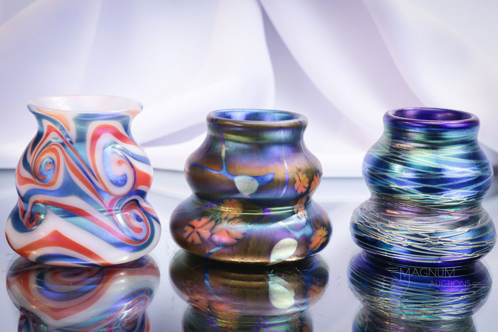 3 pc Lot Phoenix Studios Carl Radke Glass Toothpick Holders: Three fine examples of Phoenix Studios Carl Radke toothpick holders. The lot includes a King Tut patterned example and a threaded one along with a Millefiori. Tallest measures 2