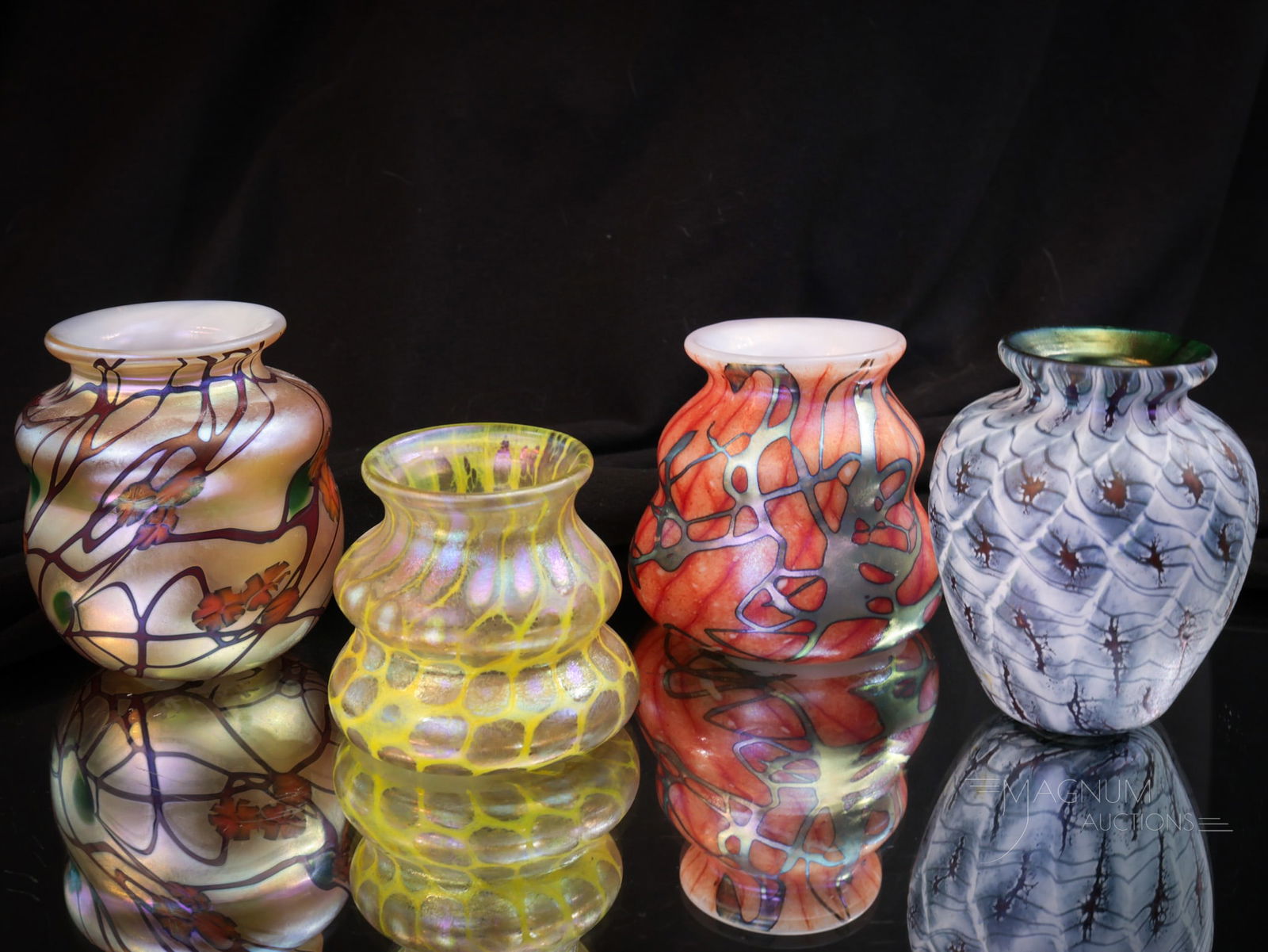 4 pc Lot Phoenix Studios Carl Radke Glass Toothpick Holders: Four fine finds in this lot of toothpick holders by Carl Radke and Phoenix Studios. Irridescent, Millefiori, and abstract designs make up this offering. Tallest measures 2 1/2" tall.